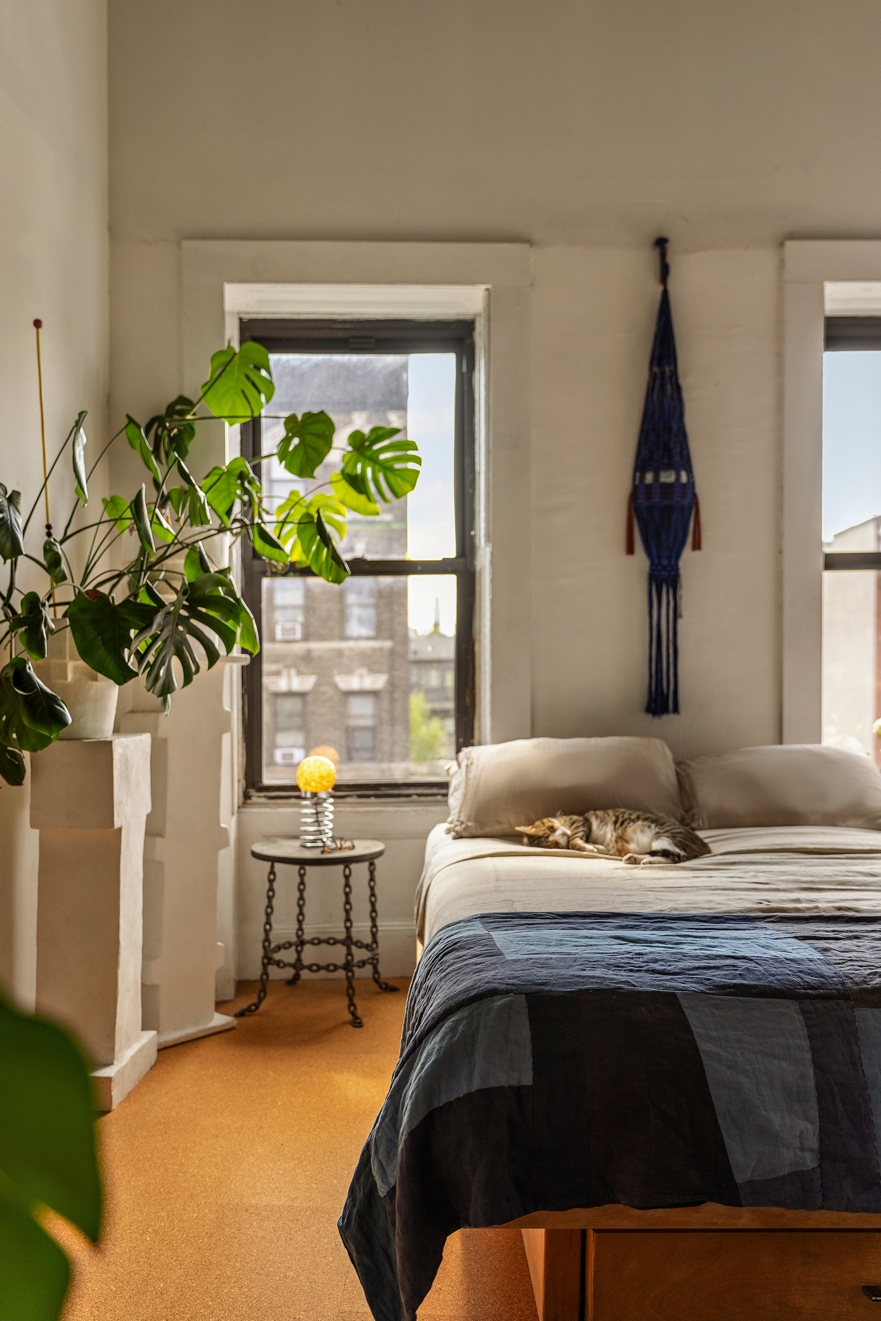 151 Grand Street, Unit 8 Brooklyn, NY 11249 - Photo 14 of 20 a bedroom with a bed and a potted plant