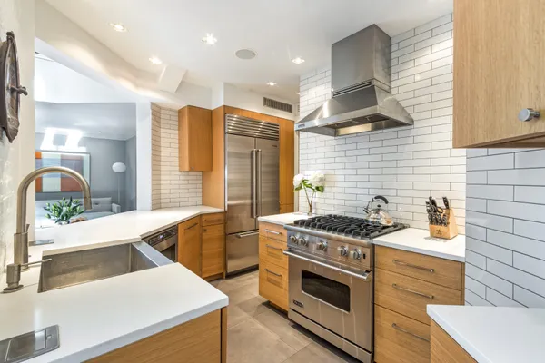 a kitchen that has a sink and a stove