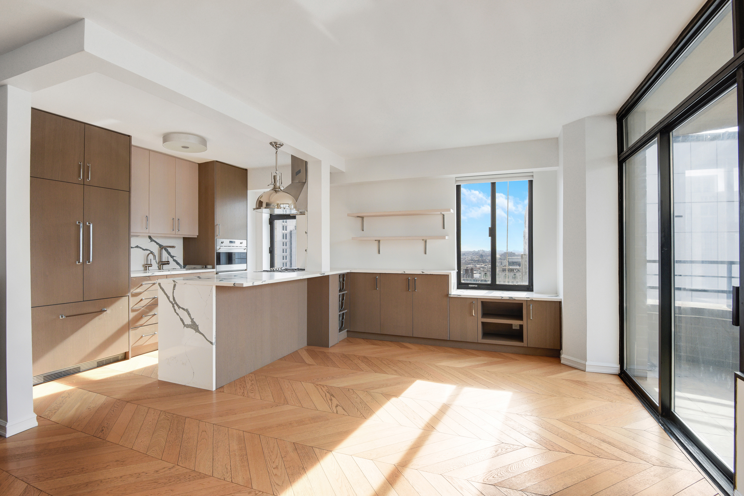 400 East 70th Street, Unit 3005 Manhattan, NY 10021 - Photo 4 of 18 a large white kitchen with a large window and refrigerator