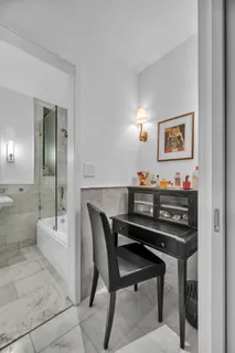 a view of a dining room with furniture and window