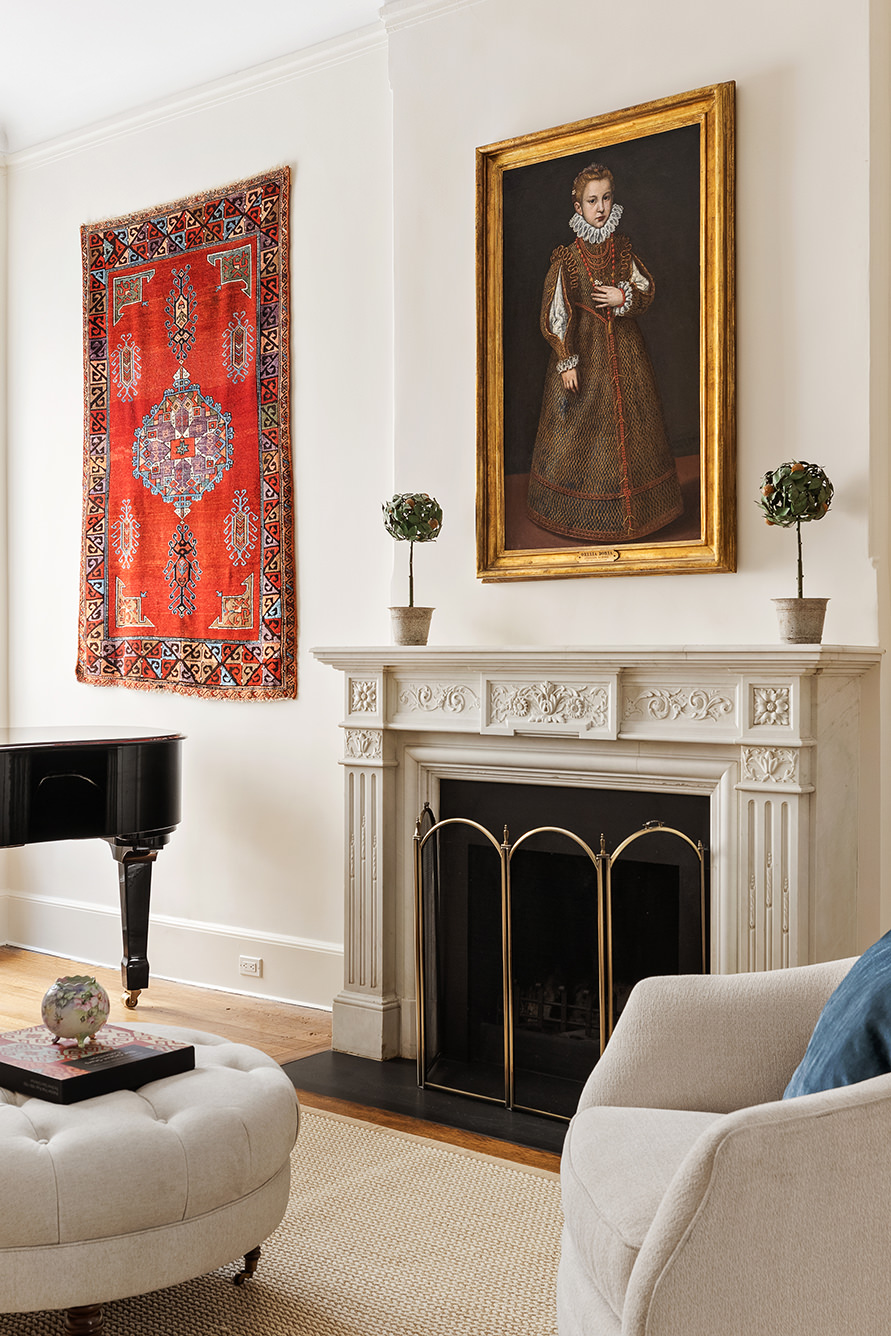 129 East 81st Street Manhattan, NY 10028 - Photo 3 of 17 a living room with furniture and a fireplace