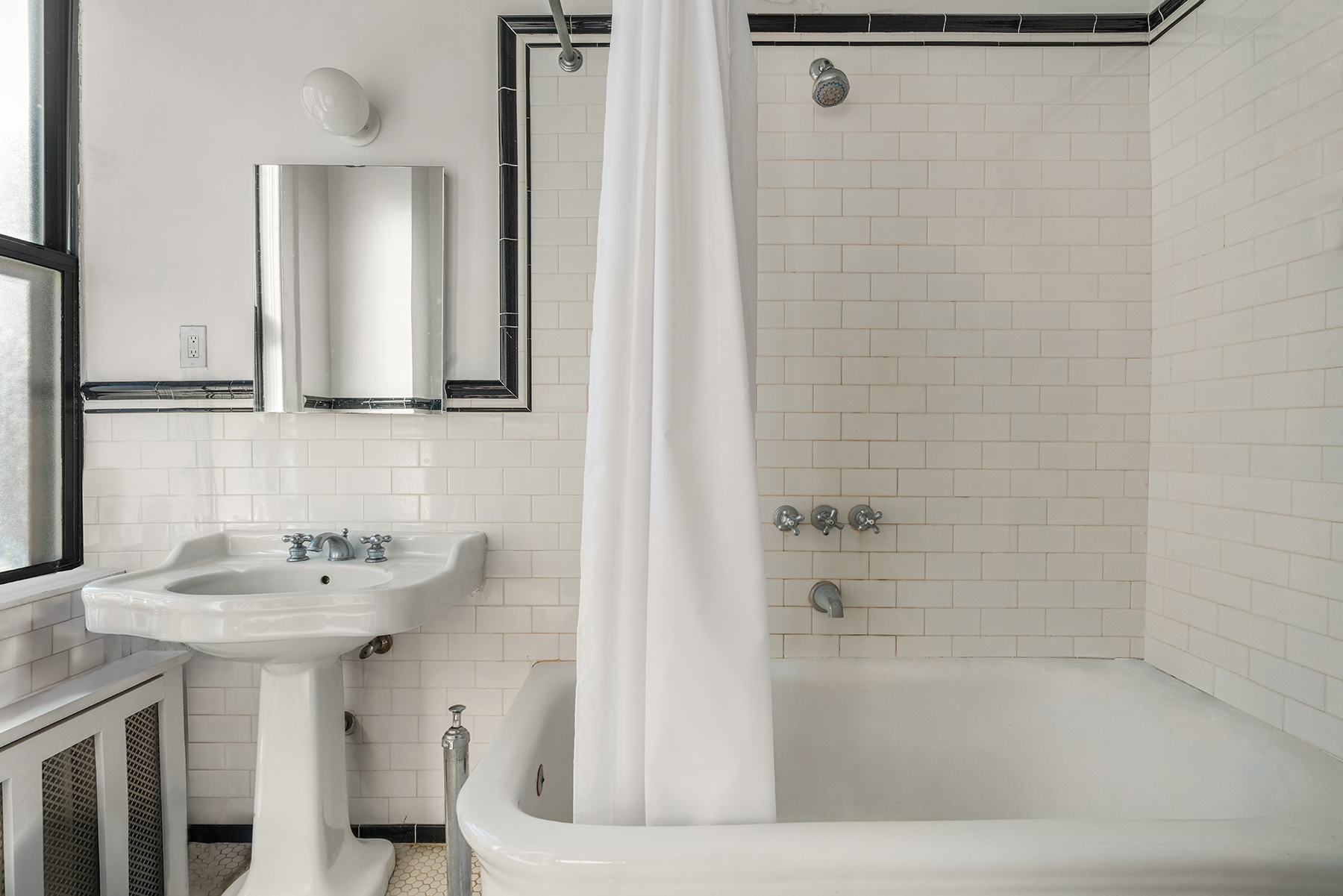 885 West End Avenue, Unit 8A Manhattan, NY 10025 - Photo 6 of 12 a bathroom with a sink and a mirror