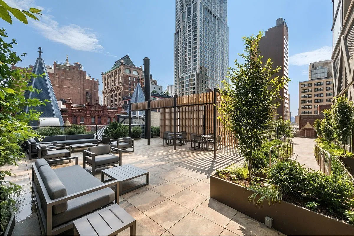 5 Beekman Street, Unit 48B Manhattan, NY 10038 - Photo 12 of 17 a view of a patio with couches and a fire pit