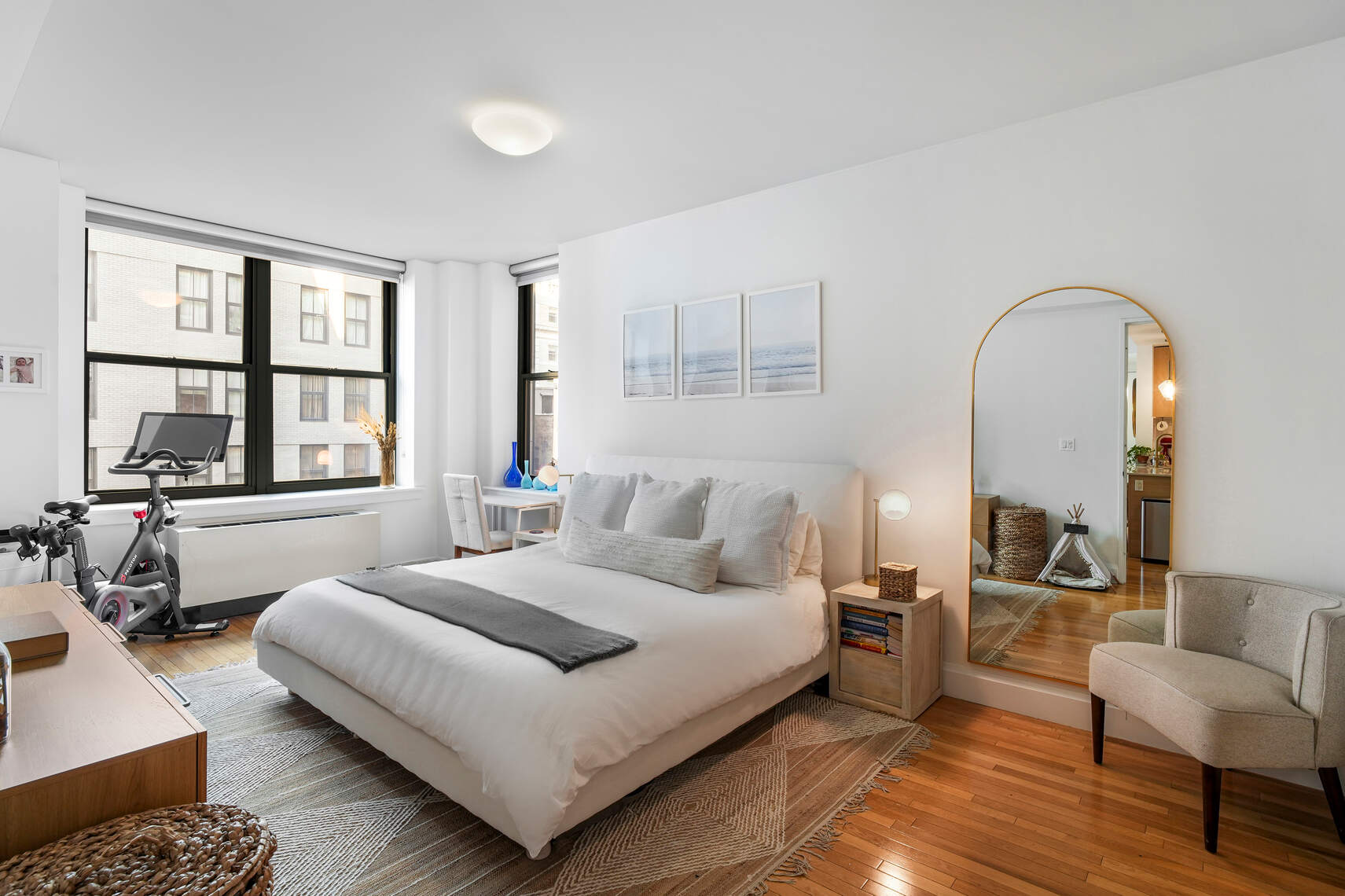 199 State Street, Unit 5C Brooklyn, NY 11201 - Photo 6 of 16 a bedroom with a bed a couch and large window