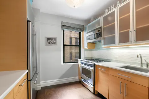 a kitchen with a stove and a sink