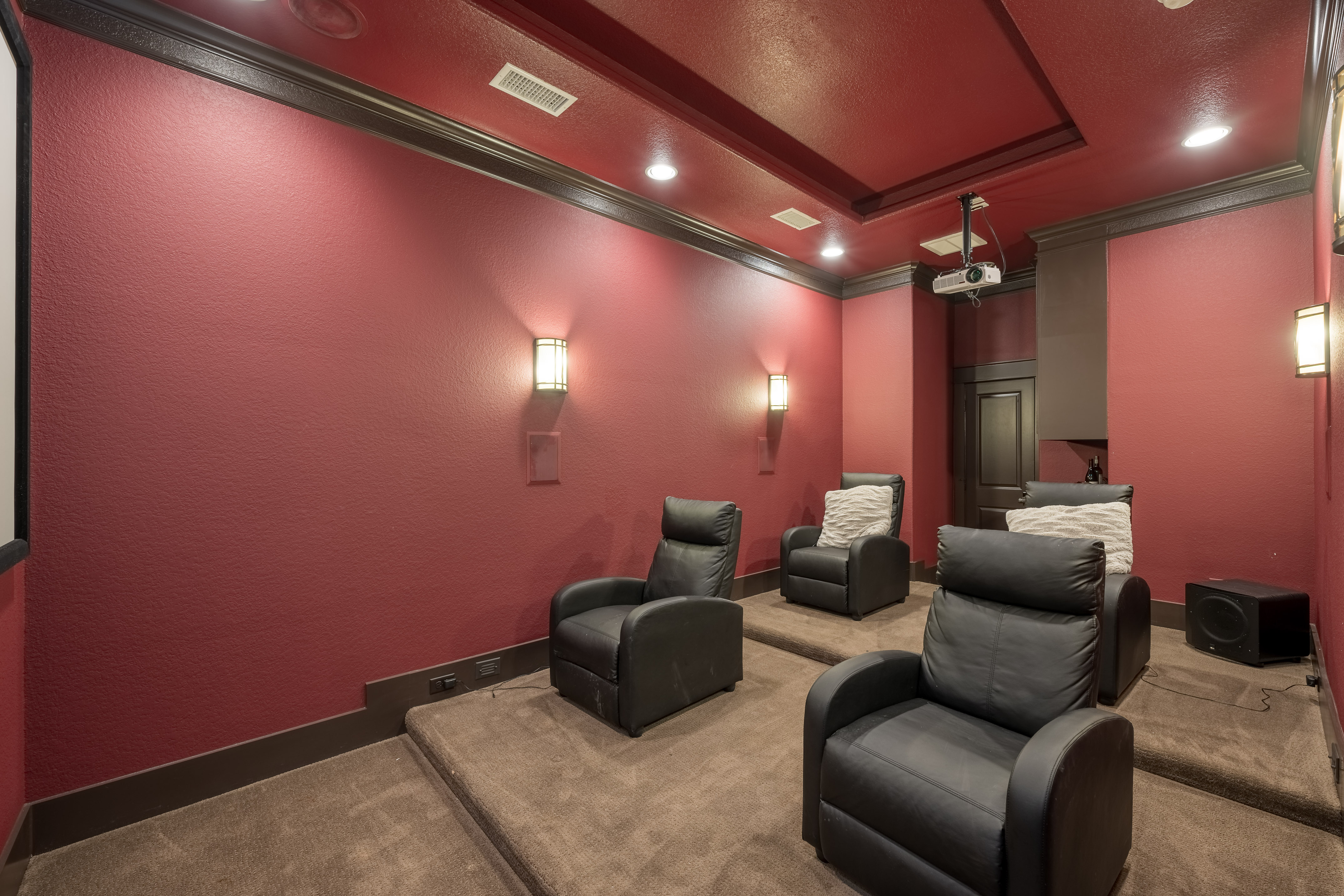 406 Fenn Street Houston, TX 77018 - Photo 16 of 33 a media room with lots of chairs and a projector screen