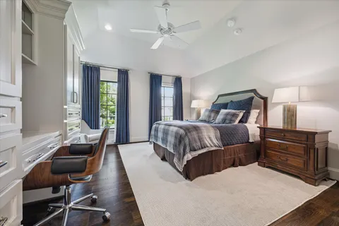 a spacious bathroom with a granite countertop sink a toilet and a shower