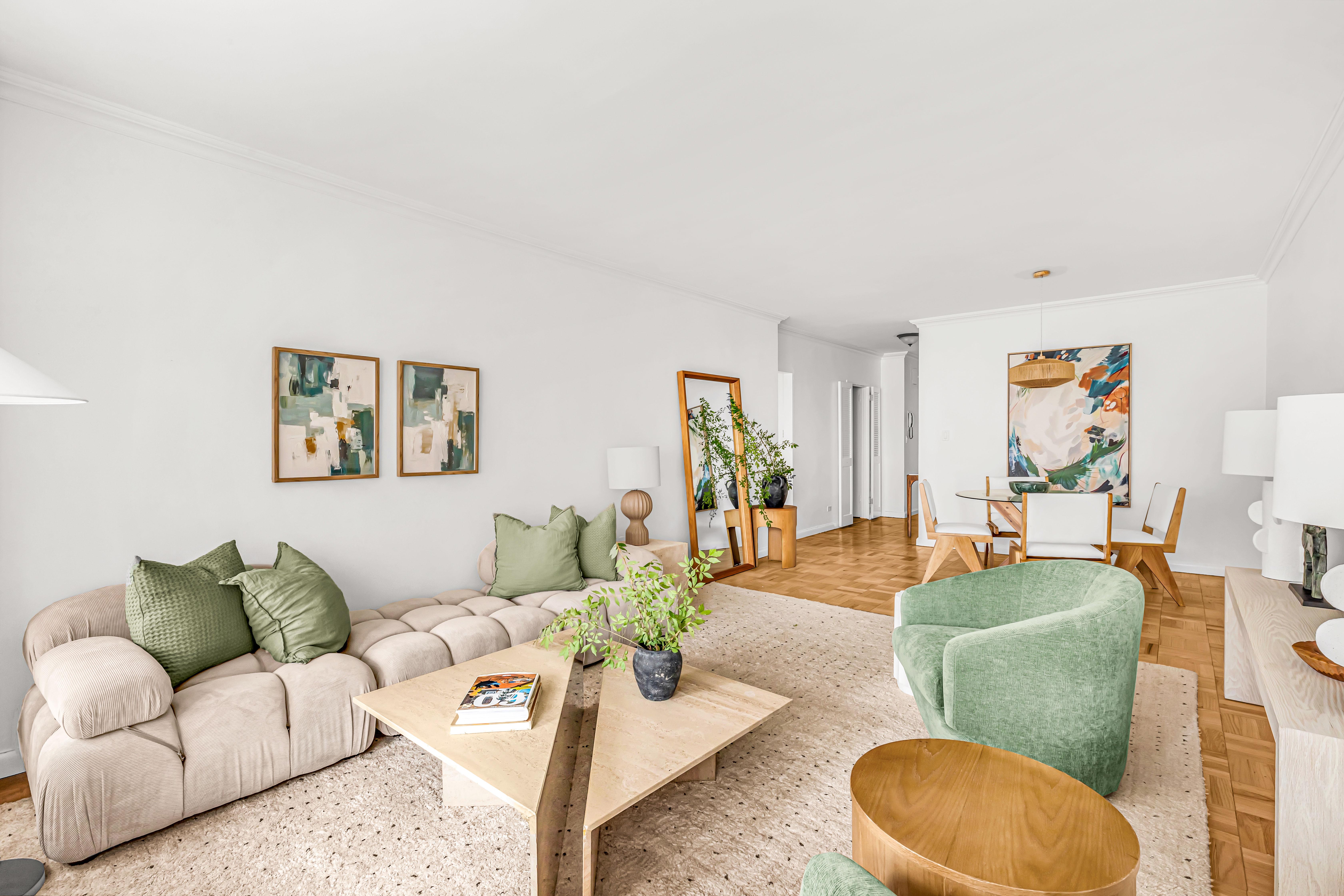 203 East 72nd Street, Unit 3E Manhattan, NY 10021 - Photo 2 of 6 a living room with furniture and a wooden floor