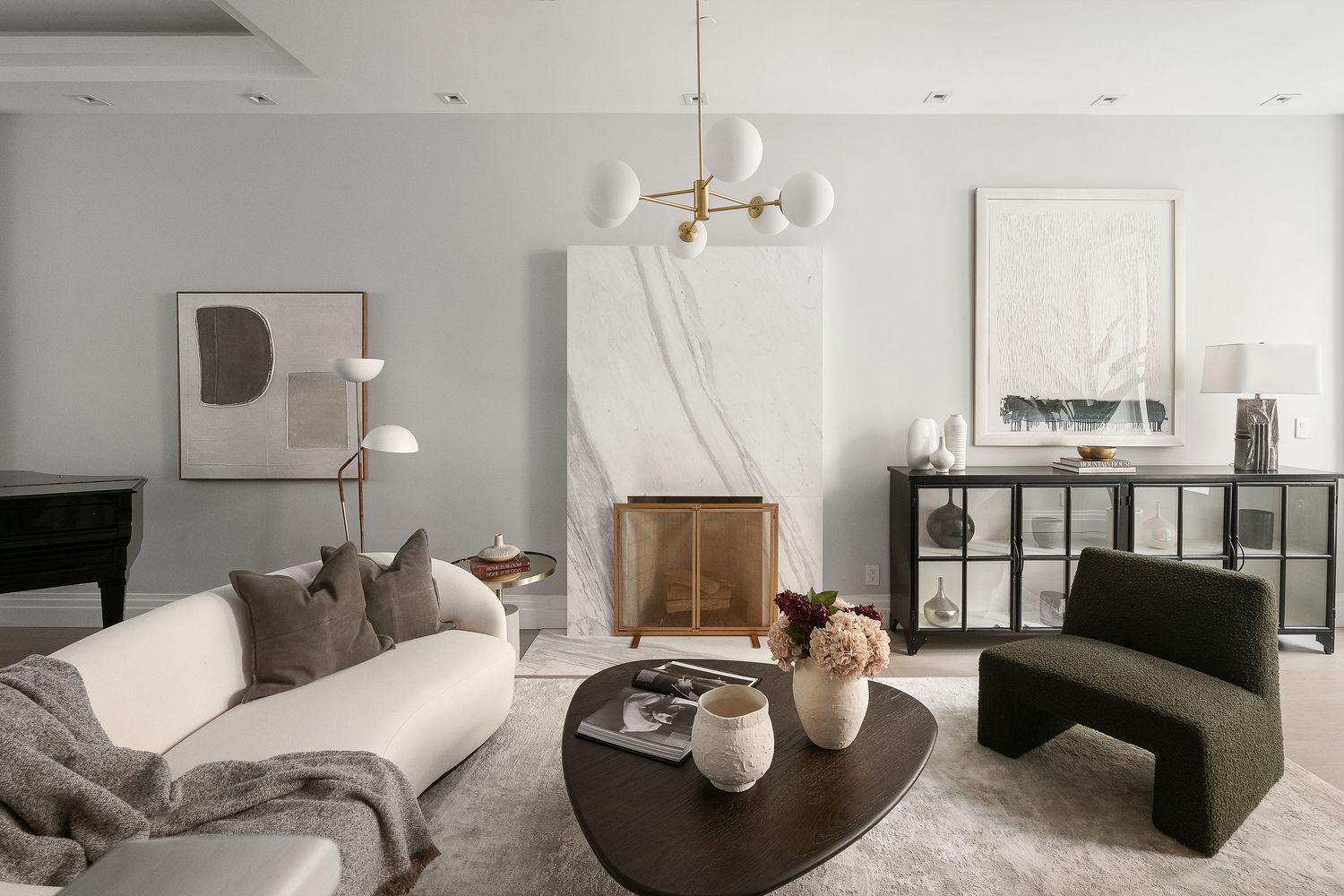 520 East 89th Street Manhattan, NY 10128 - Photo 6 of 40 a living room with furniture a couch and a chandelier