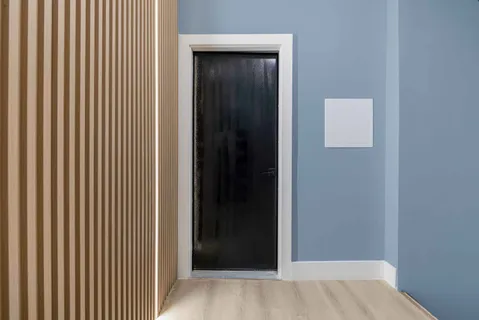 a view of a hallway with a wooden floor