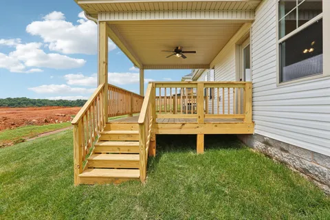 a view of backyard with deck having outdoor seating