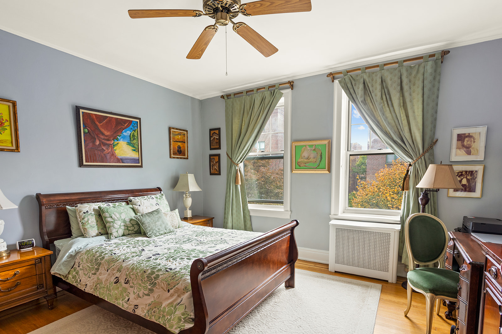 34-27 79th Street, Unit 42 Queens, NY 11372 - Photo 10 of 15 a bedroom with a bed and a window