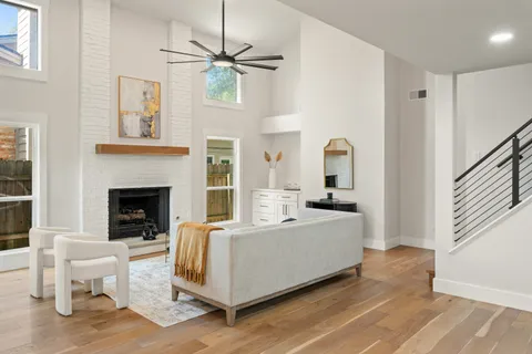 a living room with furniture and a fireplace