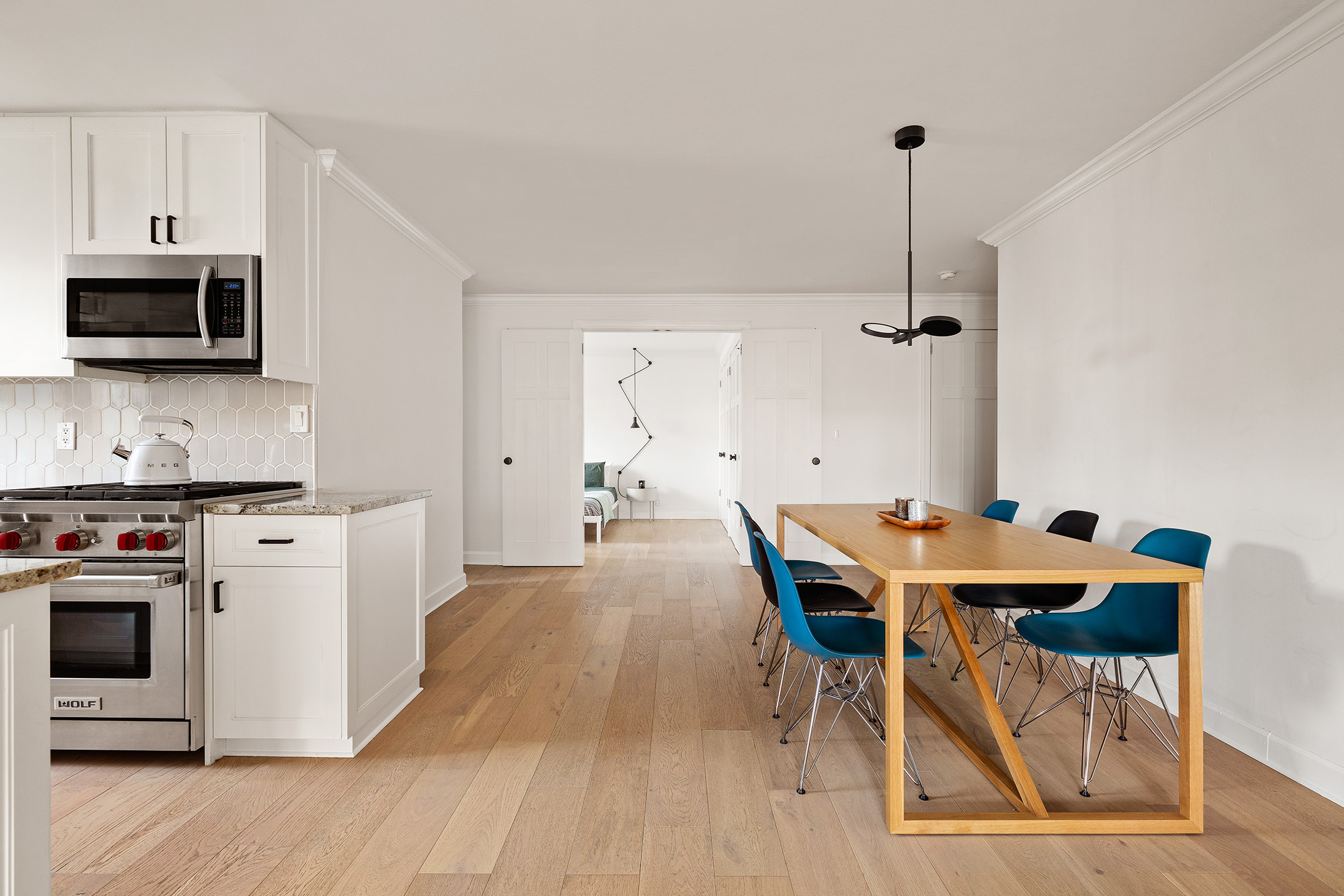 305 East 24th Street, Unit 11G Manhattan, NY 10010 - Photo 4 of 10 a kitchen with stainless steel appliances a stove a sink and a refrigerator
