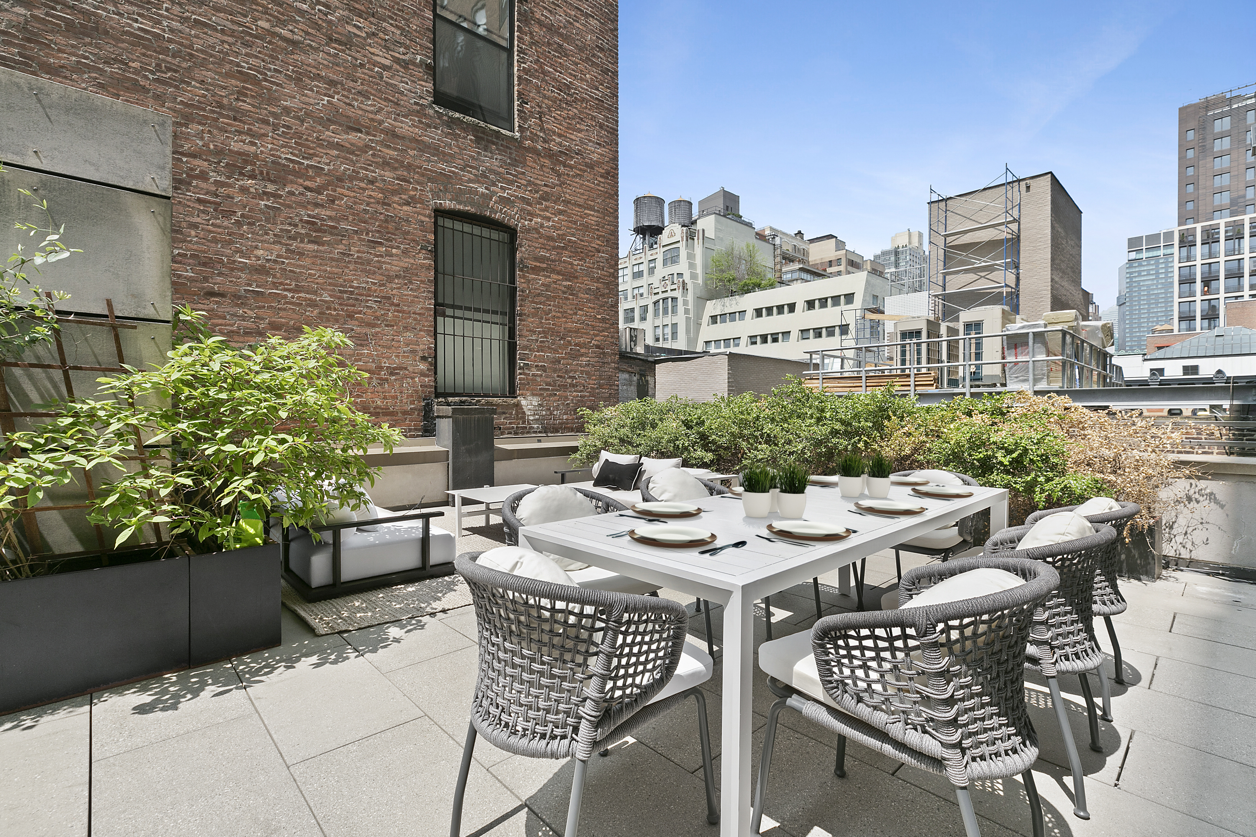 29 West 21st Street, Unit PH Manhattan, NY 10010 - Photo 7 of 17 a view of a patio with a table and chairs