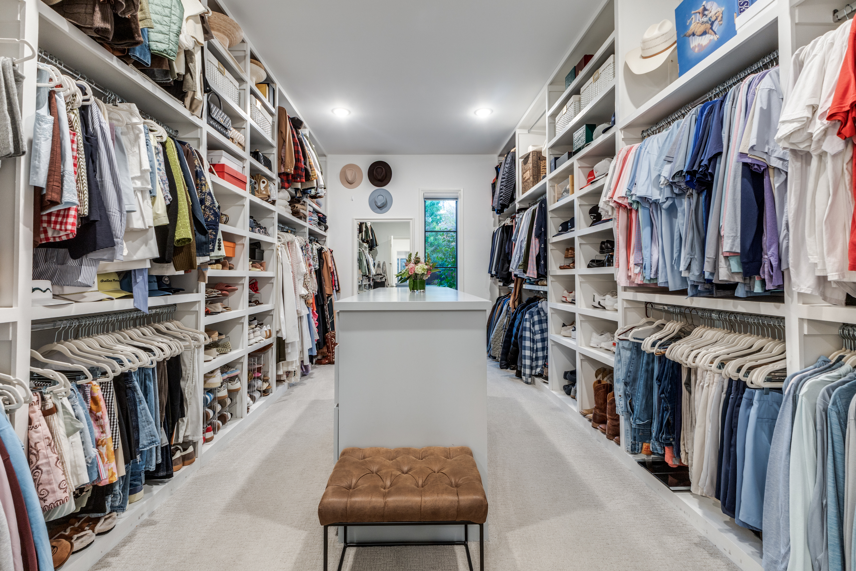 4042 Dunhaven Road Dallas, TX 75220 - Photo 22 of 34 a view of walk in closet with clothes and shoes