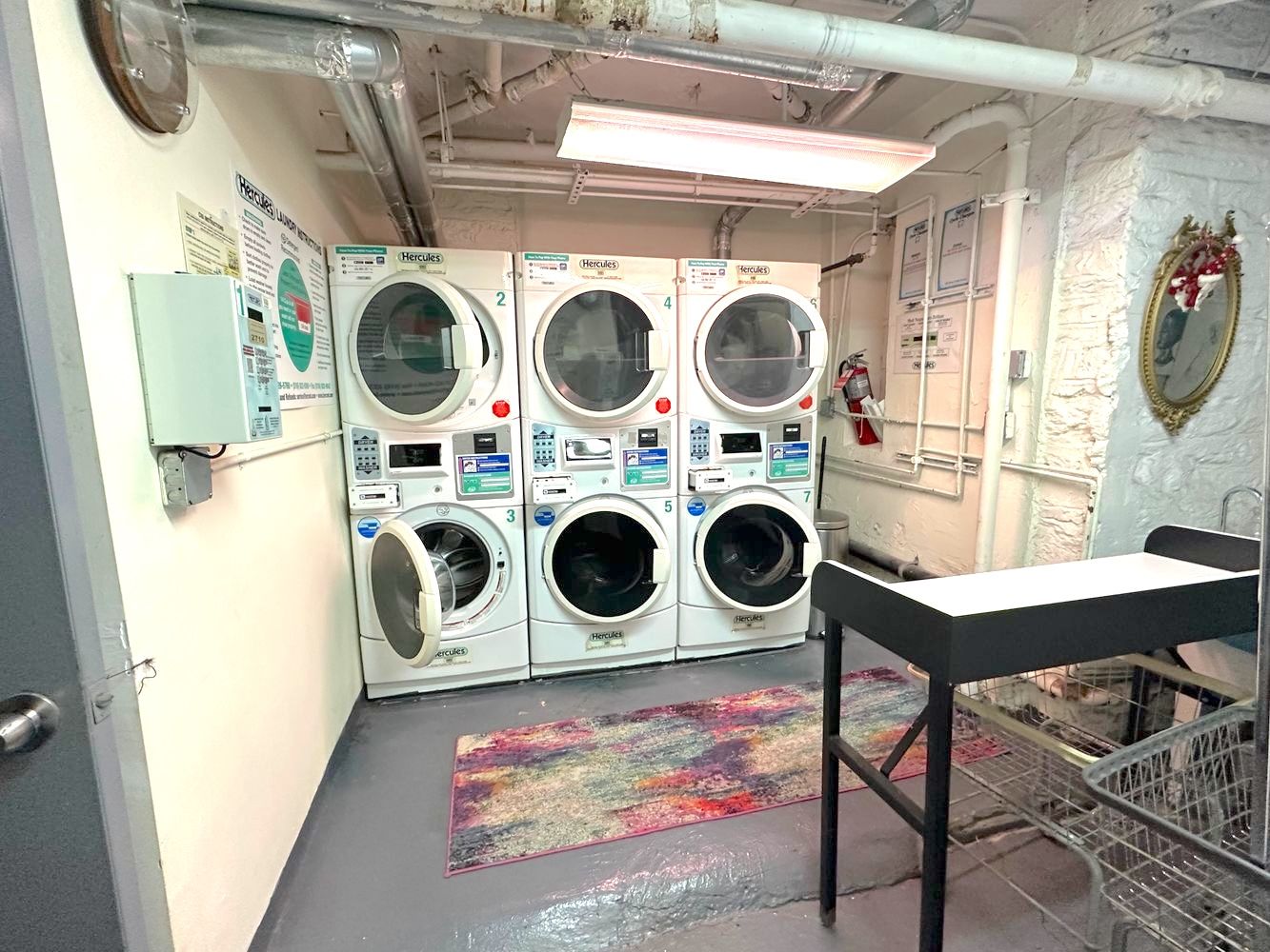 245 West 115th Street, Unit 16 Manhattan, NY 10026 - Photo 7 of 10 a utility room with dryer and washer