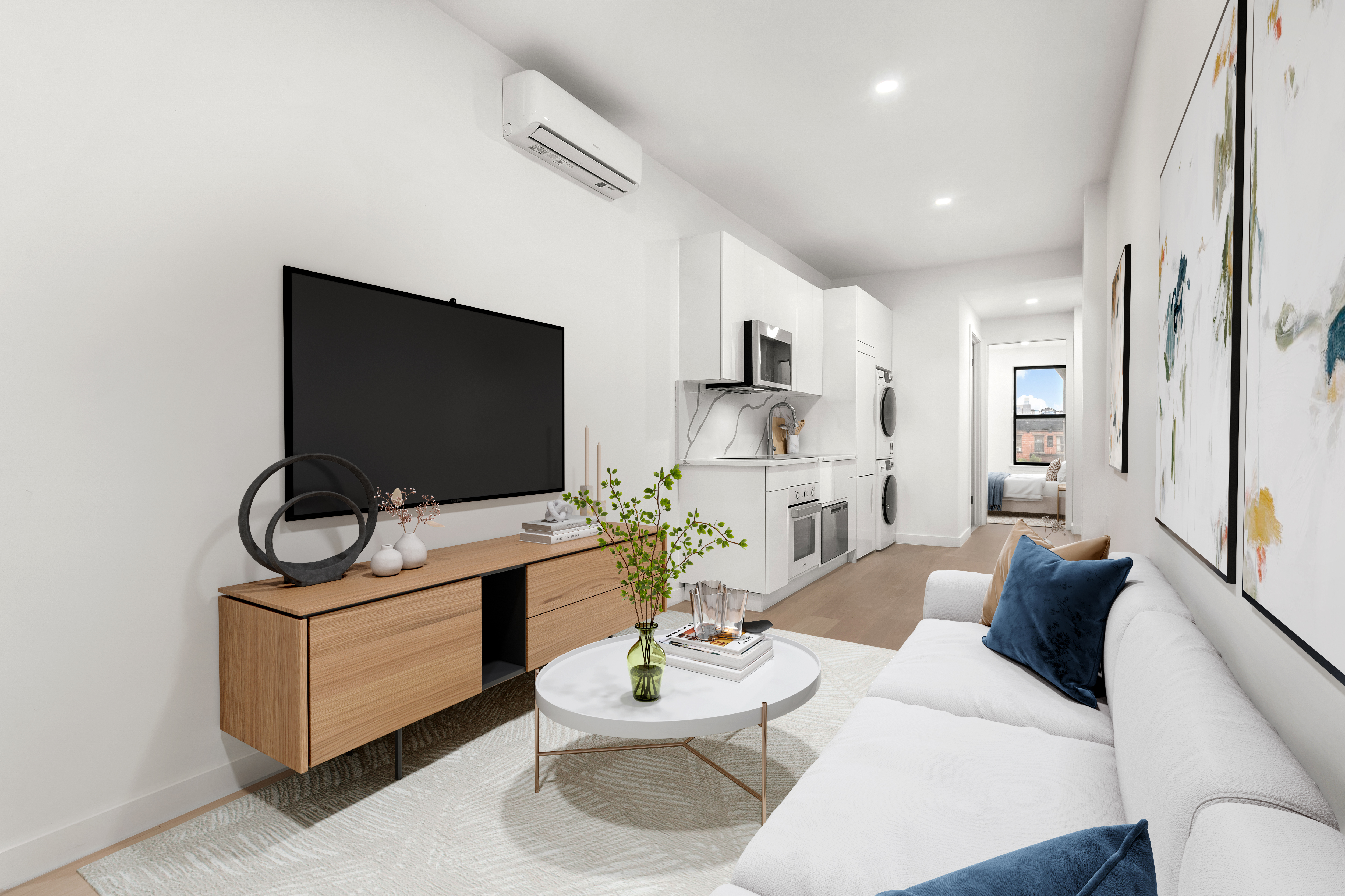 177 East 3rd Street, Unit 2A Manhattan, NY 10009 - Photo 1 of 8 a living room with furniture a flat screen tv and kitchen view