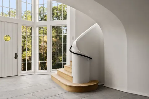 a view of staircase with a rug