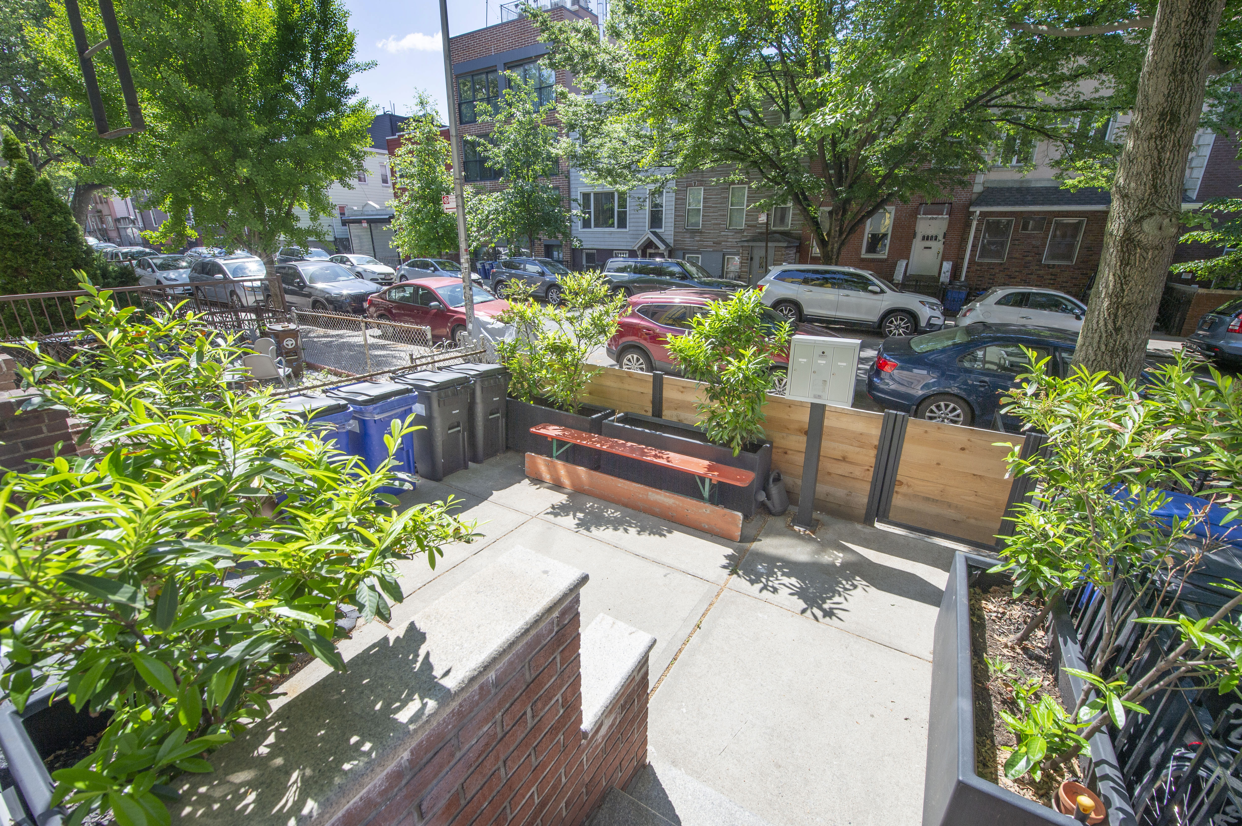 185 A Powers Street, Unit 1 Brooklyn, NY 11211 - Photo 10 of 13 a view of a backyard with plants and a patio