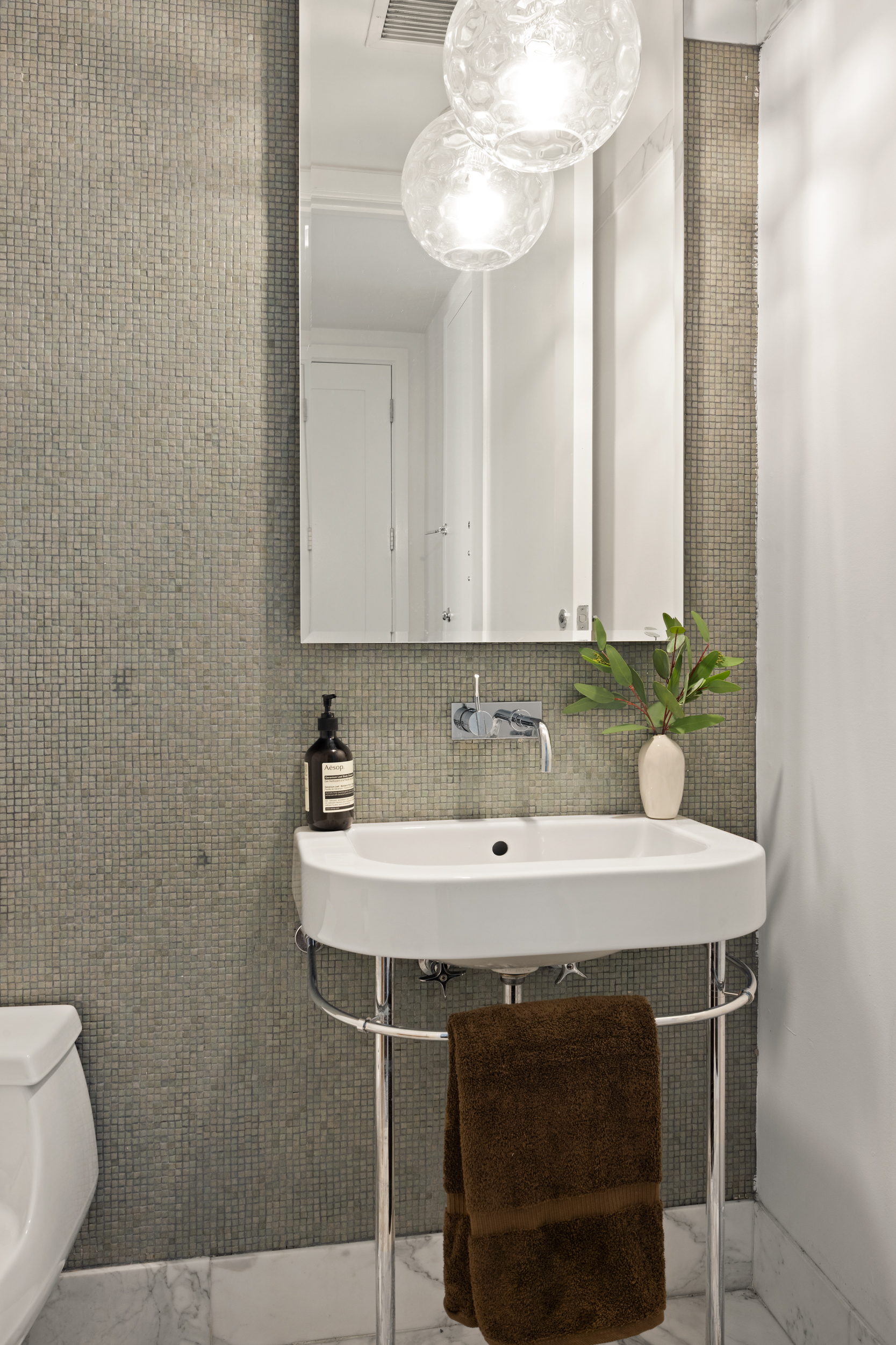 260 Park Avenue South, Unit 9G Manhattan, NY 10010 - Photo 12 of 17 a sink with a table and chairs