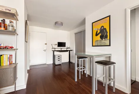 a view of kitchen and dining room with wooden floor