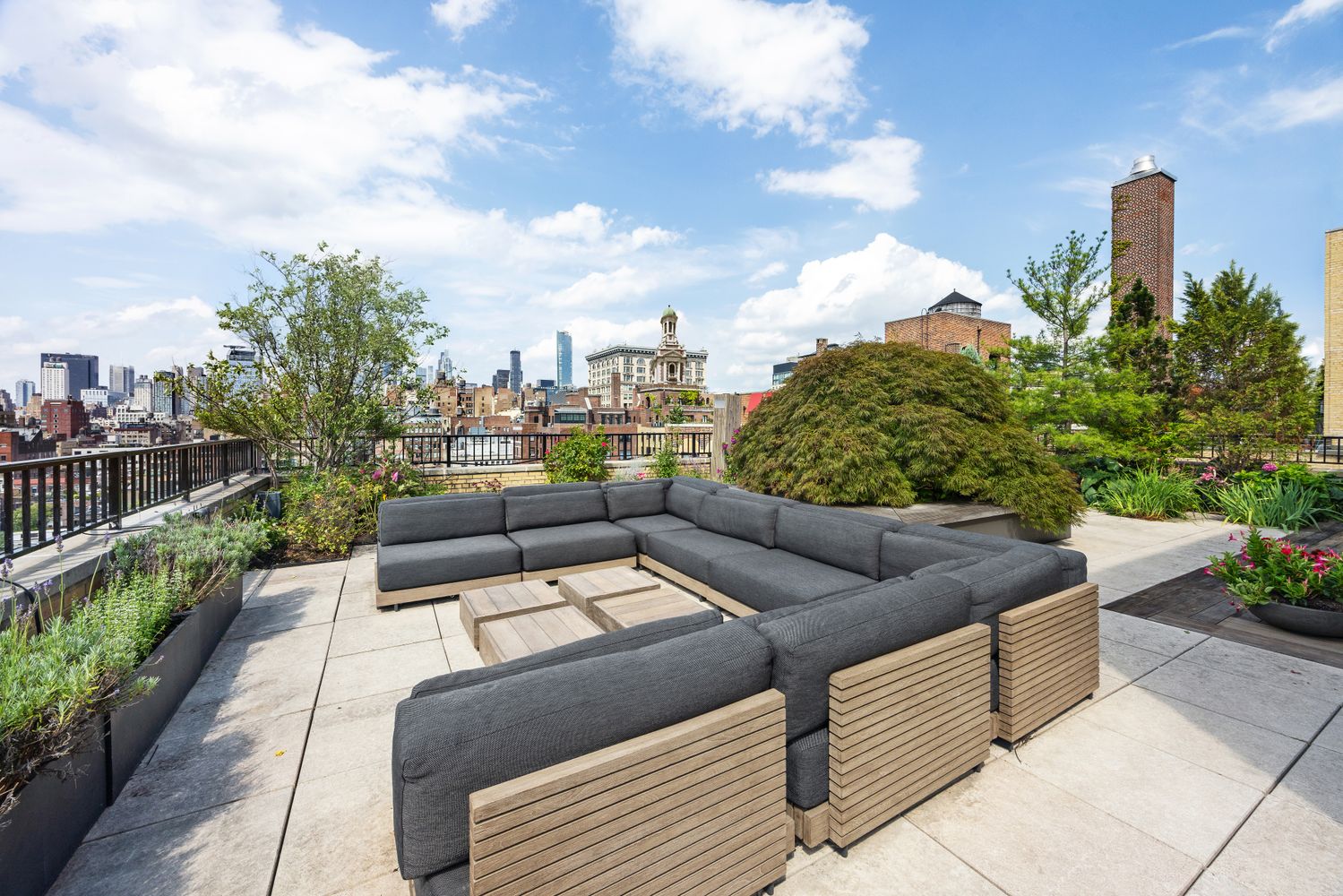 a view of a terrace with couches and potted plants