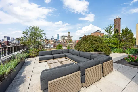 a view of a terrace with couches and potted plants
