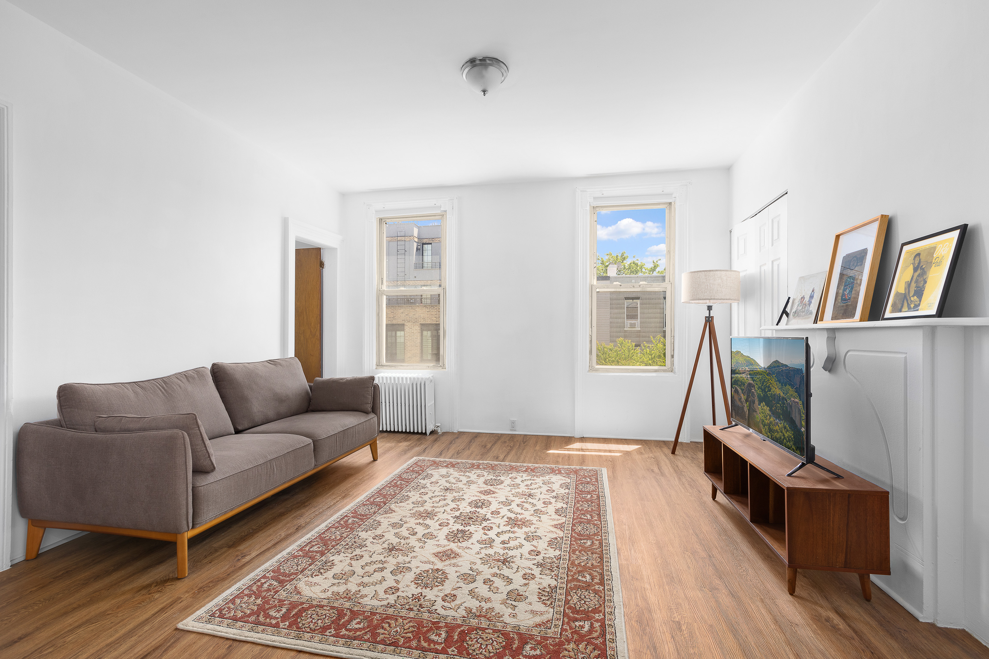 39 Broome Street Brooklyn, NY 11222 - Photo 8 of 16 a living room with a couch and a window