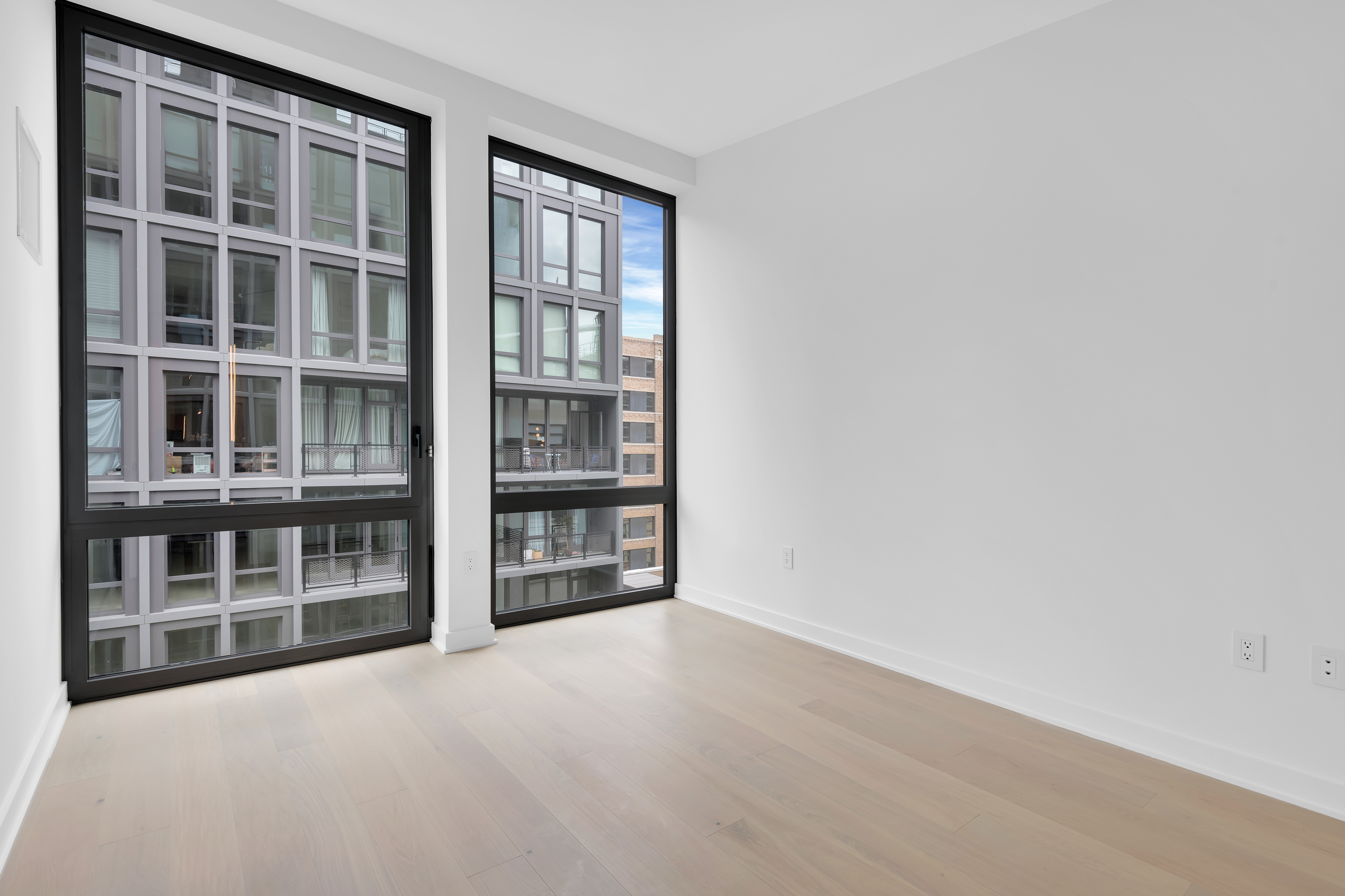 77 Charlton Street, Unit S11G Manhattan, NY 10014 - Photo 3 of 9 a view of an empty room with a window
