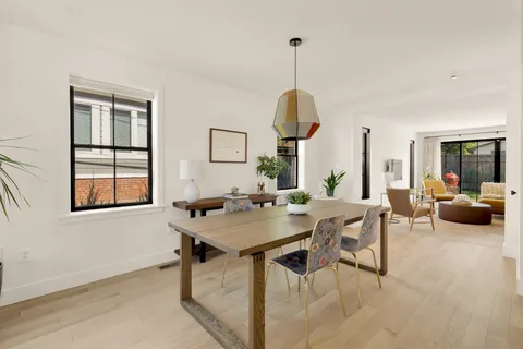 a view of a livingroom with furniture and window