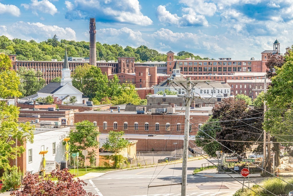 1 Maple Street, Unit 1 Maynard, MA 01754 - Photo 8 of 42 a view of a city with tall buildings