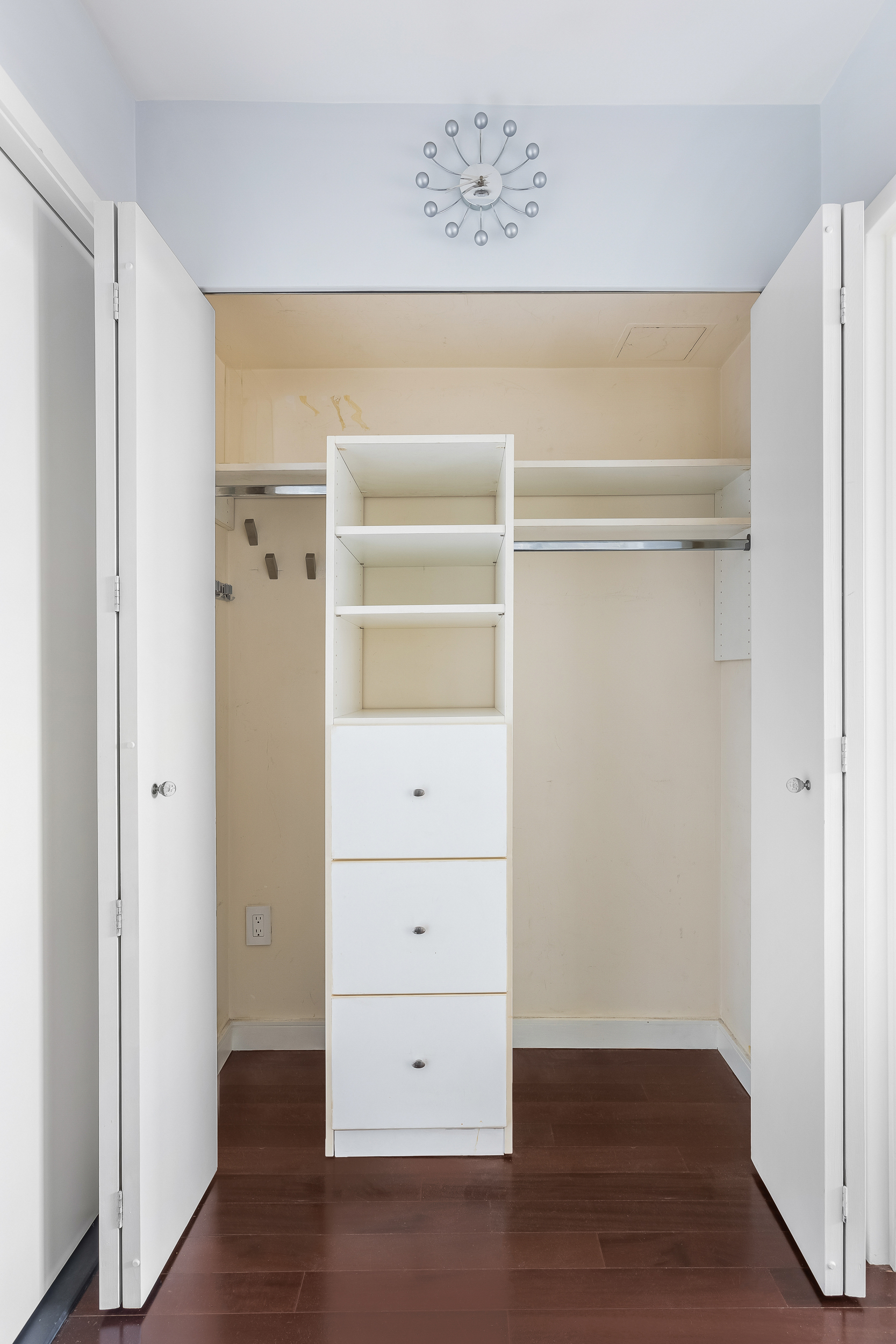 376 Broadway, Unit 14E Manhattan, NY 10013 - Photo 8 of 11 a view of walk in closet with empty racks