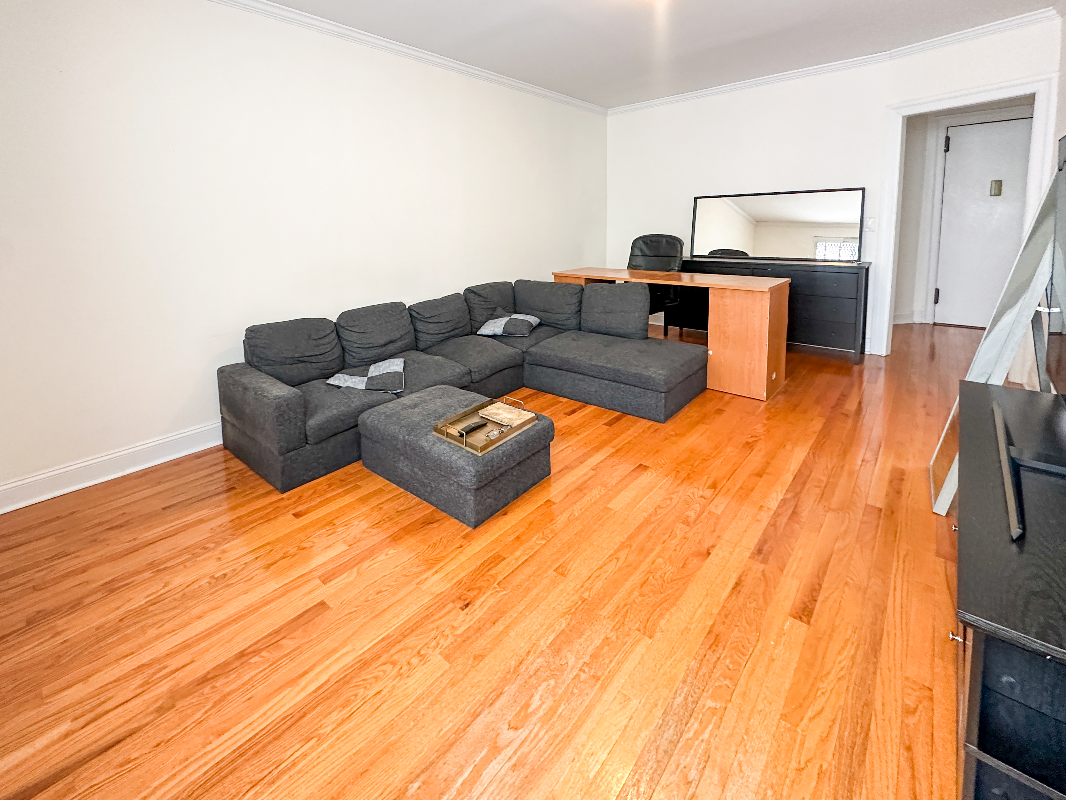 1506 Overing Street, Unit 1D Bronx, NY 10461 - Photo 6 of 10 a living room with furniture and a wooden floor