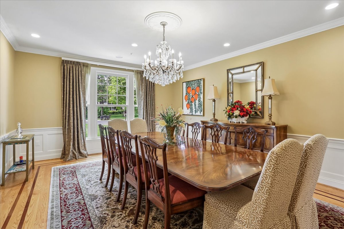 11736 Gainsborough Road Potomac, MD 20854 - Photo 30 of 90 a dining room with furniture a rug and wooden floor