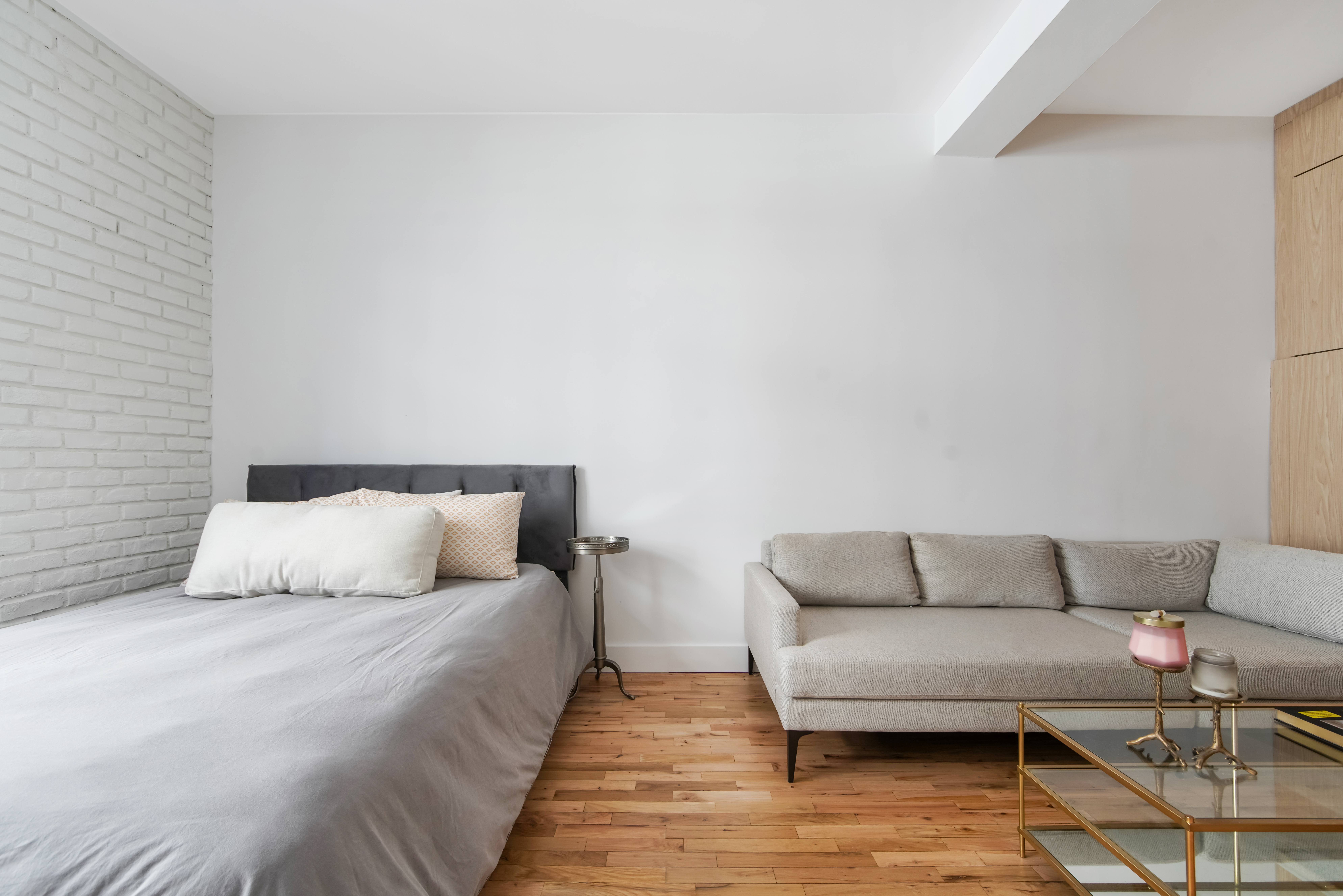 310 East 23rd Street, Unit 3B Manhattan, NY 10010 - Photo 5 of 11 a living room with furniture and a couch