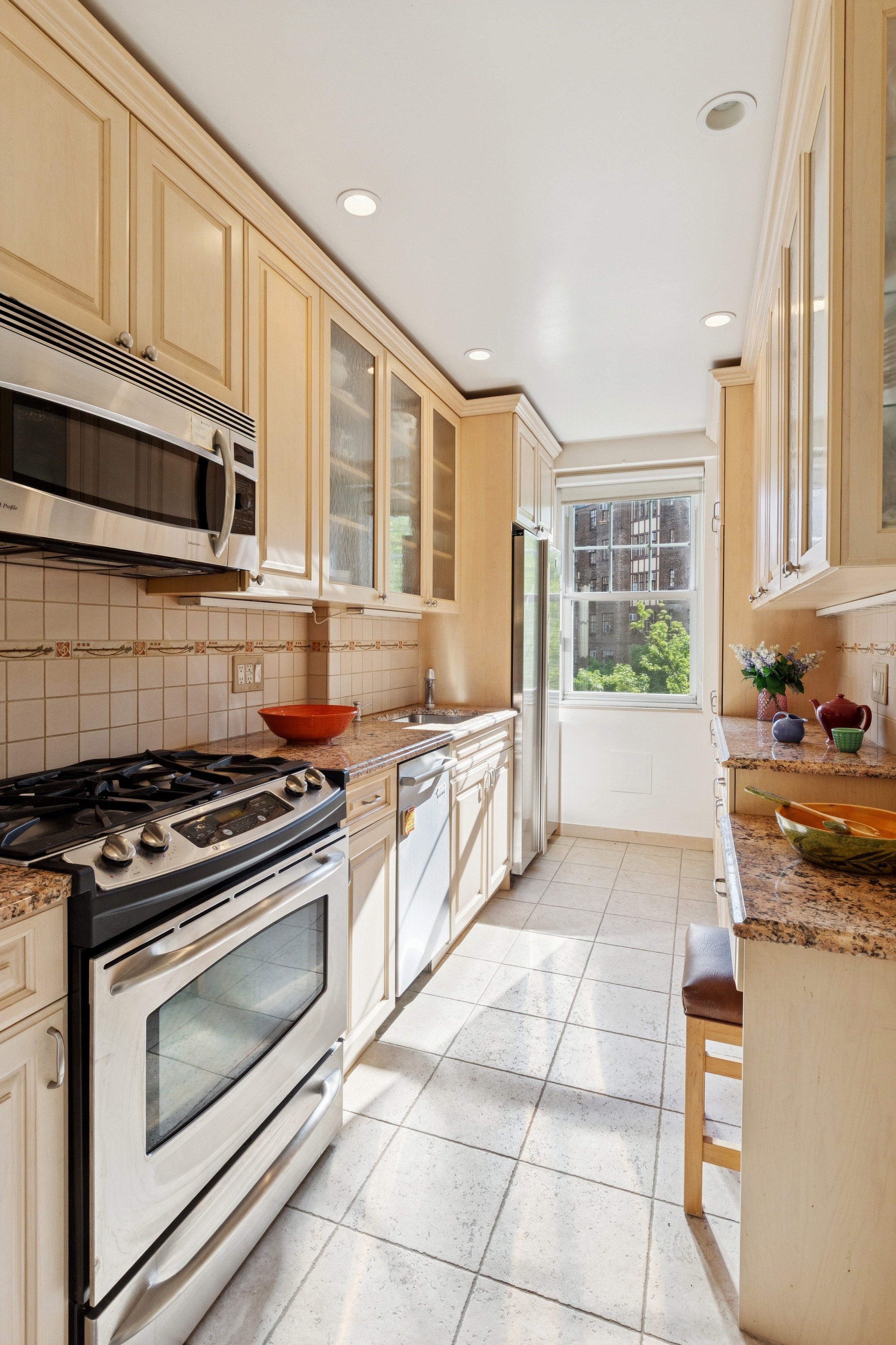180 Cabrini Boulevard, Unit 54 Manhattan, NY 10033 - Photo 6 of 23 a kitchen with stainless steel appliances granite countertop a stove and a sink