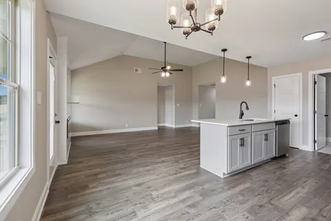 a view of a double vanity sink a mirror and a window