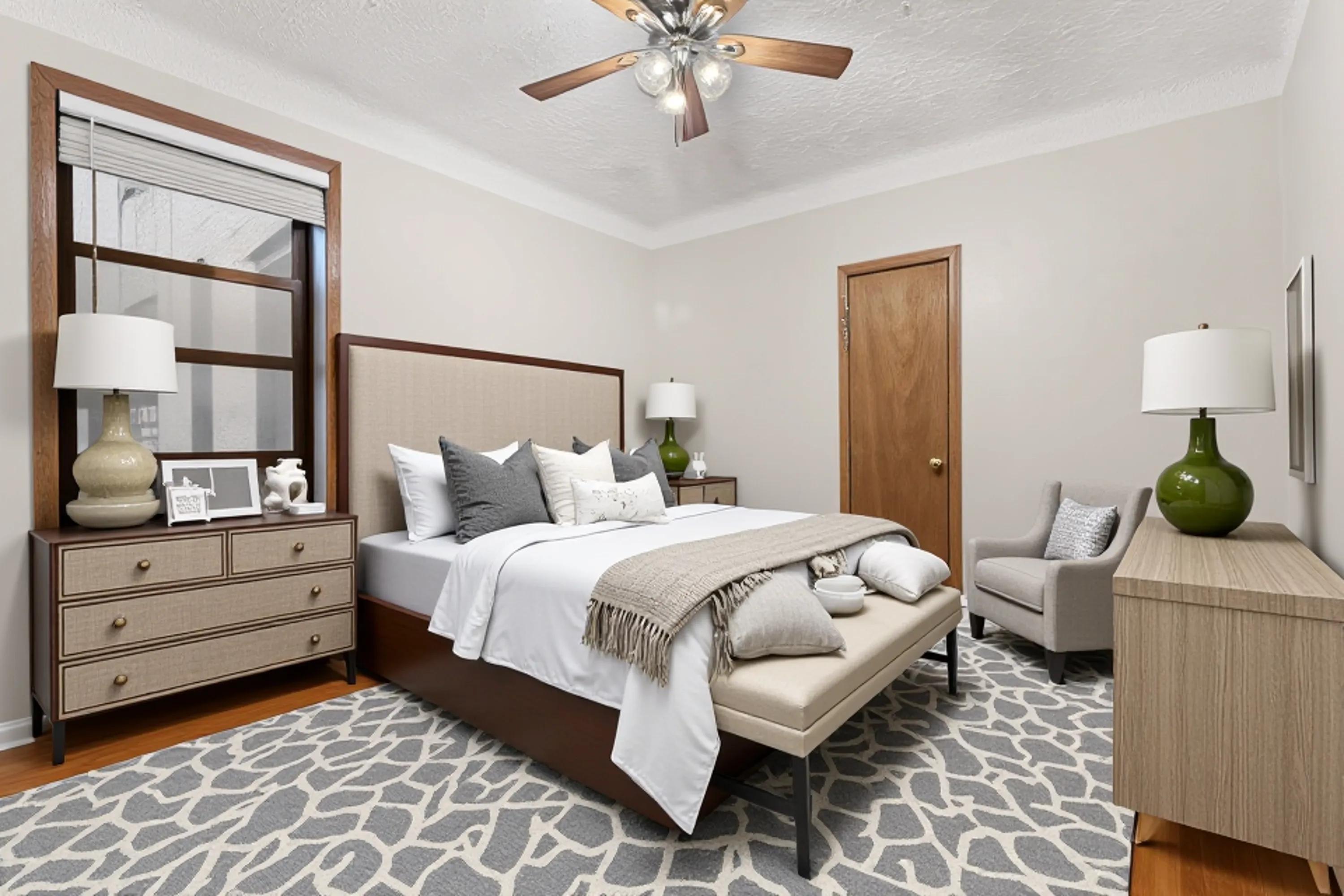 527 West 143rd Street, Unit 31 Manhattan, NY 10031 - Photo 13 of 29 a bedroom with a bed and a chandelier