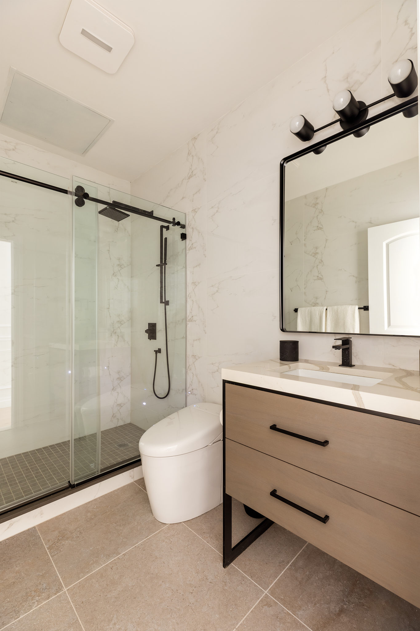 143 Milton Street Brooklyn, NY 11222 - Photo 12 of 19 a bathroom with a bathtub shower sink and mirror