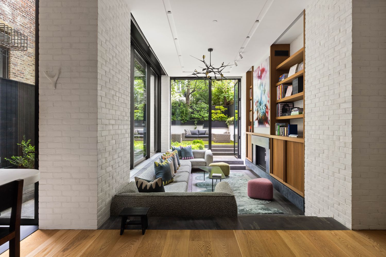 a living room with furniture large window and flat screen tv