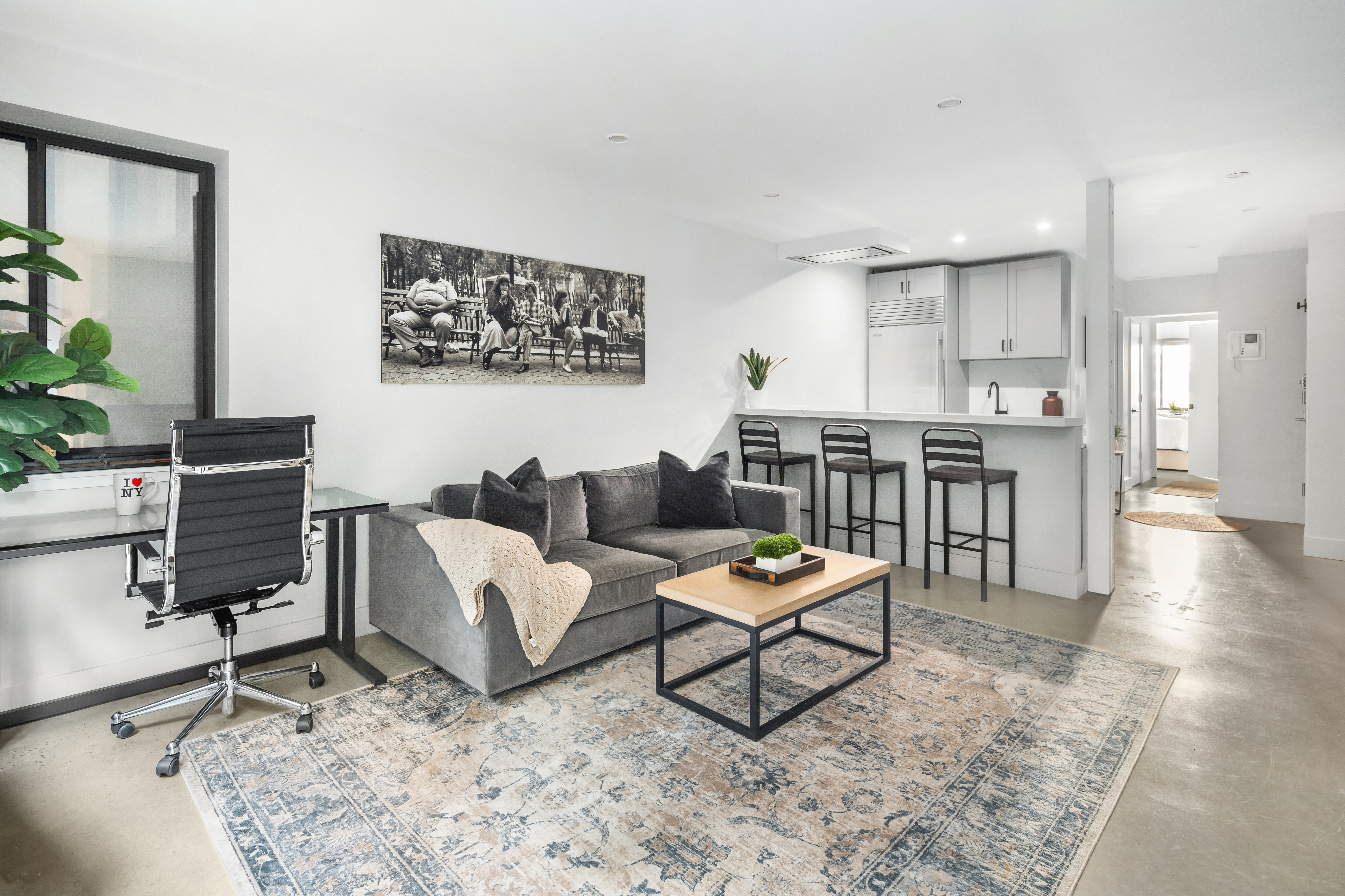 164 Bank Street, Unit 3A Manhattan, NY 10014 - Photo 2 of 8 a living room with furniture and a wooden floor