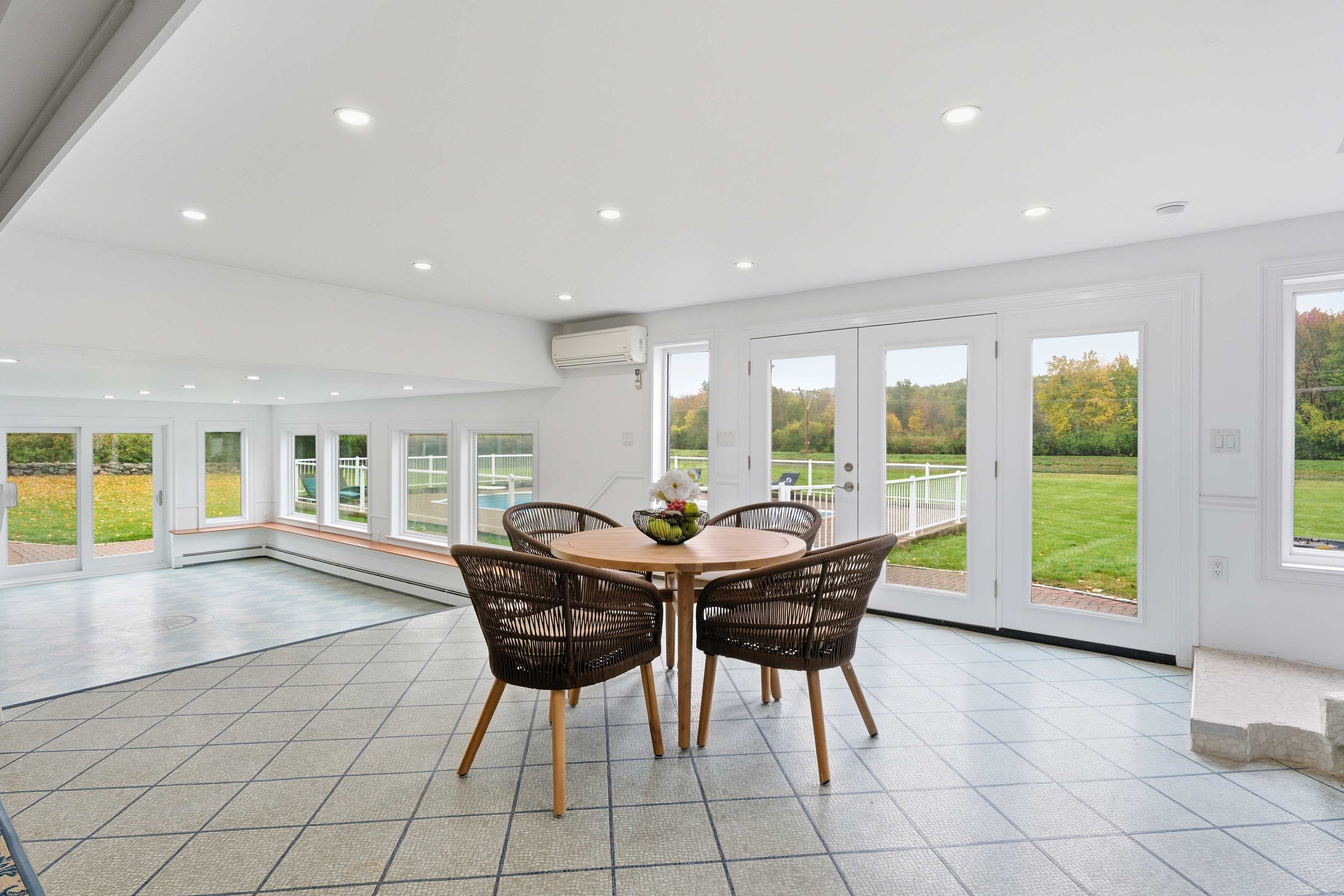 6 Lynbrook Road Southborough, MA 01772 - Photo 52 of 84 a view of a dining room with furniture large windows and wooden floor