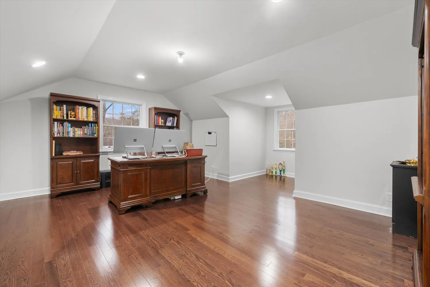 a bathroom with a granite countertop sink a toilet and a shower