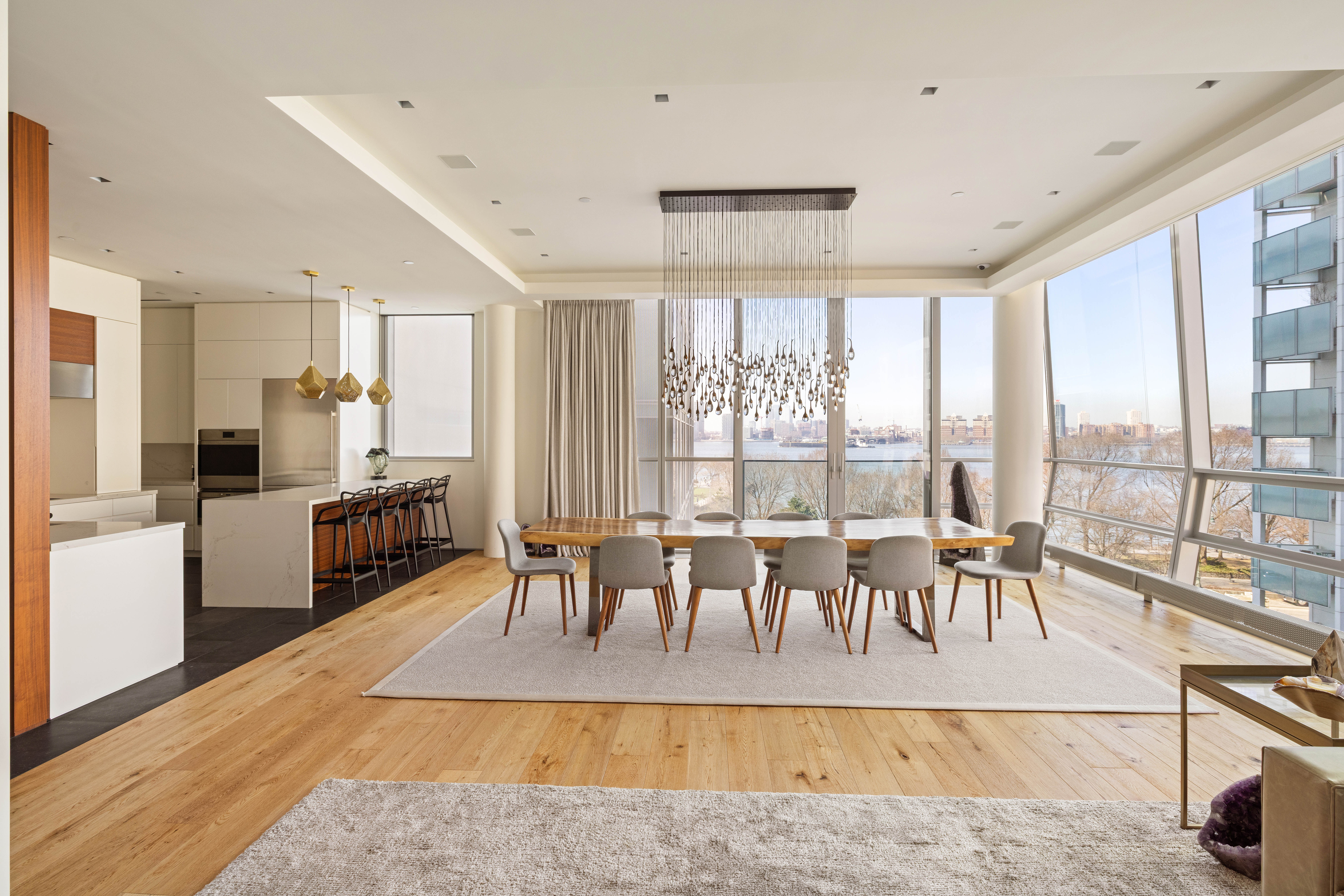 166 Perry Street, Unit 5A Manhattan, NY 10014 - Photo 4 of 25 a living room with furniture large windows dining table and a large window