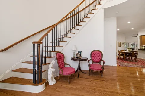 a living room with dining room and kitchen view