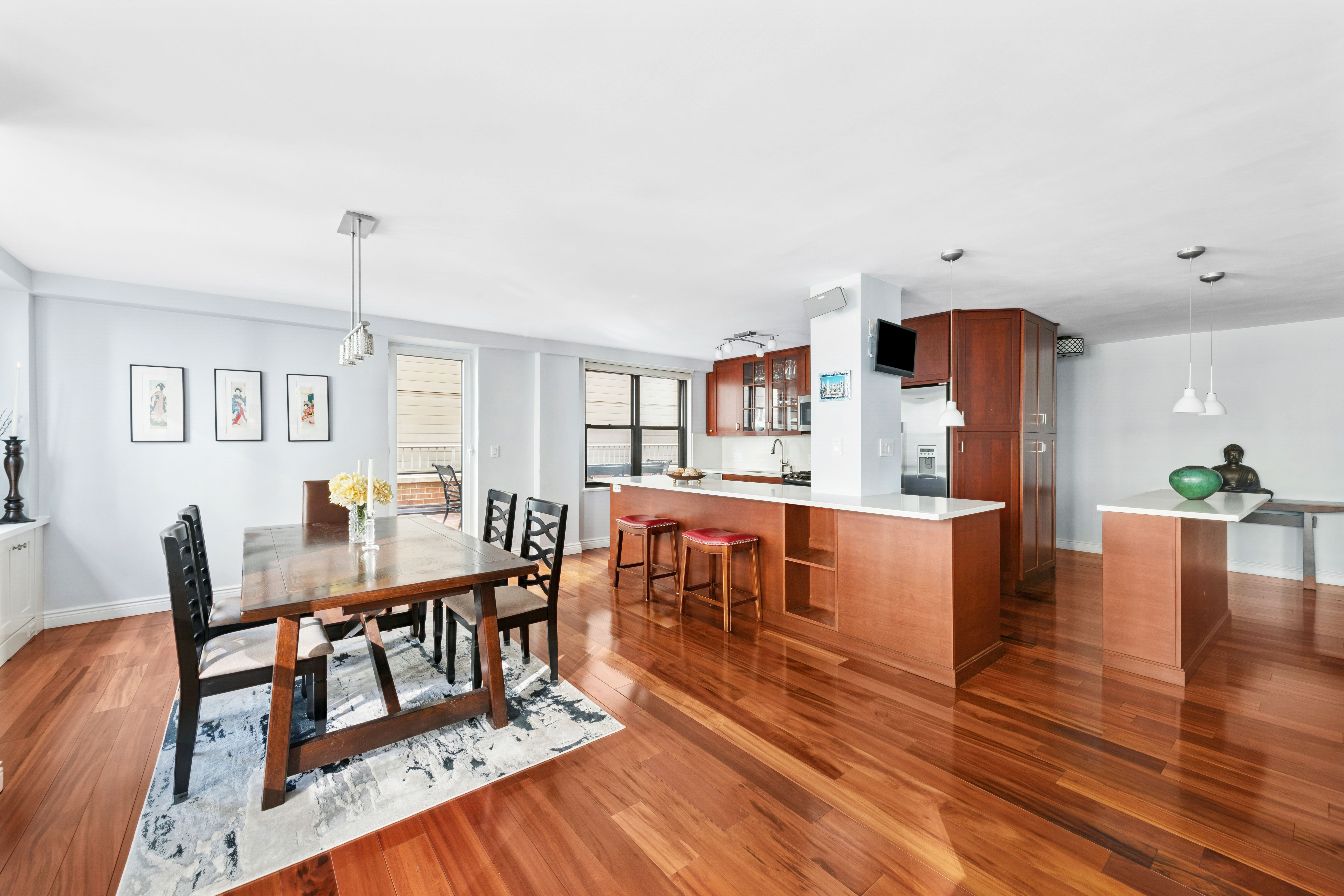 305 East 40th Street, Unit 19CD Manhattan, NY 10016 - Photo 2 of 16 a living room with furniture a dining table and wooden floor