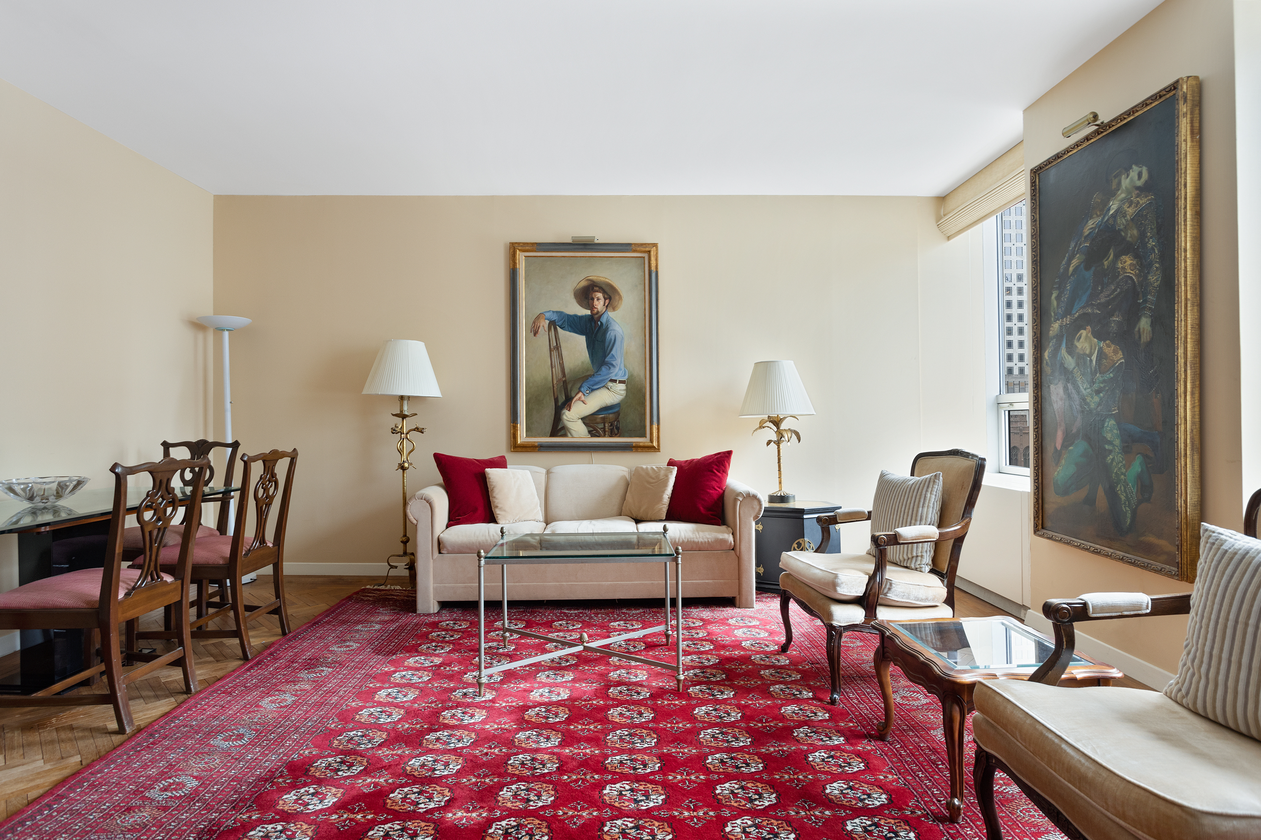 15 West 53rd Street, Unit 11H Manhattan, NY 10019 - Photo 4 of 11 a living room with furniture a rug and a table