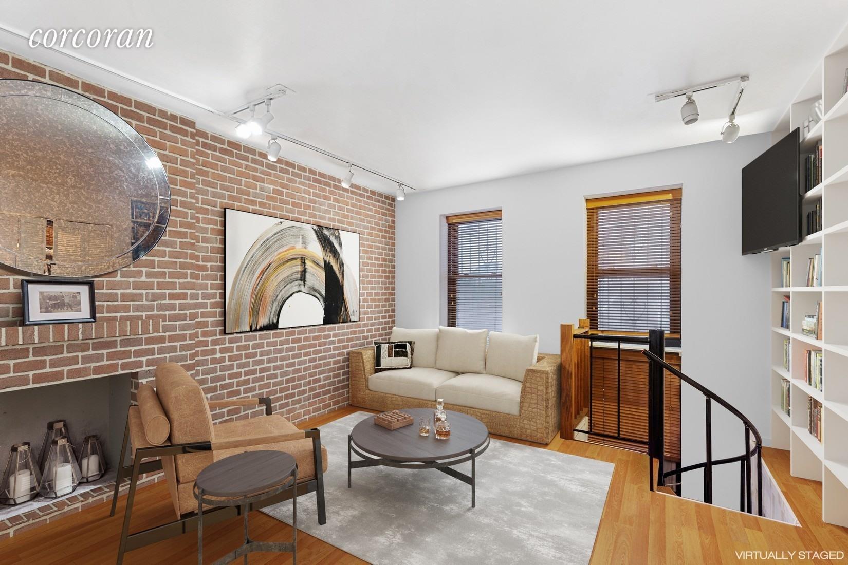 a living room with furniture a flat screen tv and kitchen view