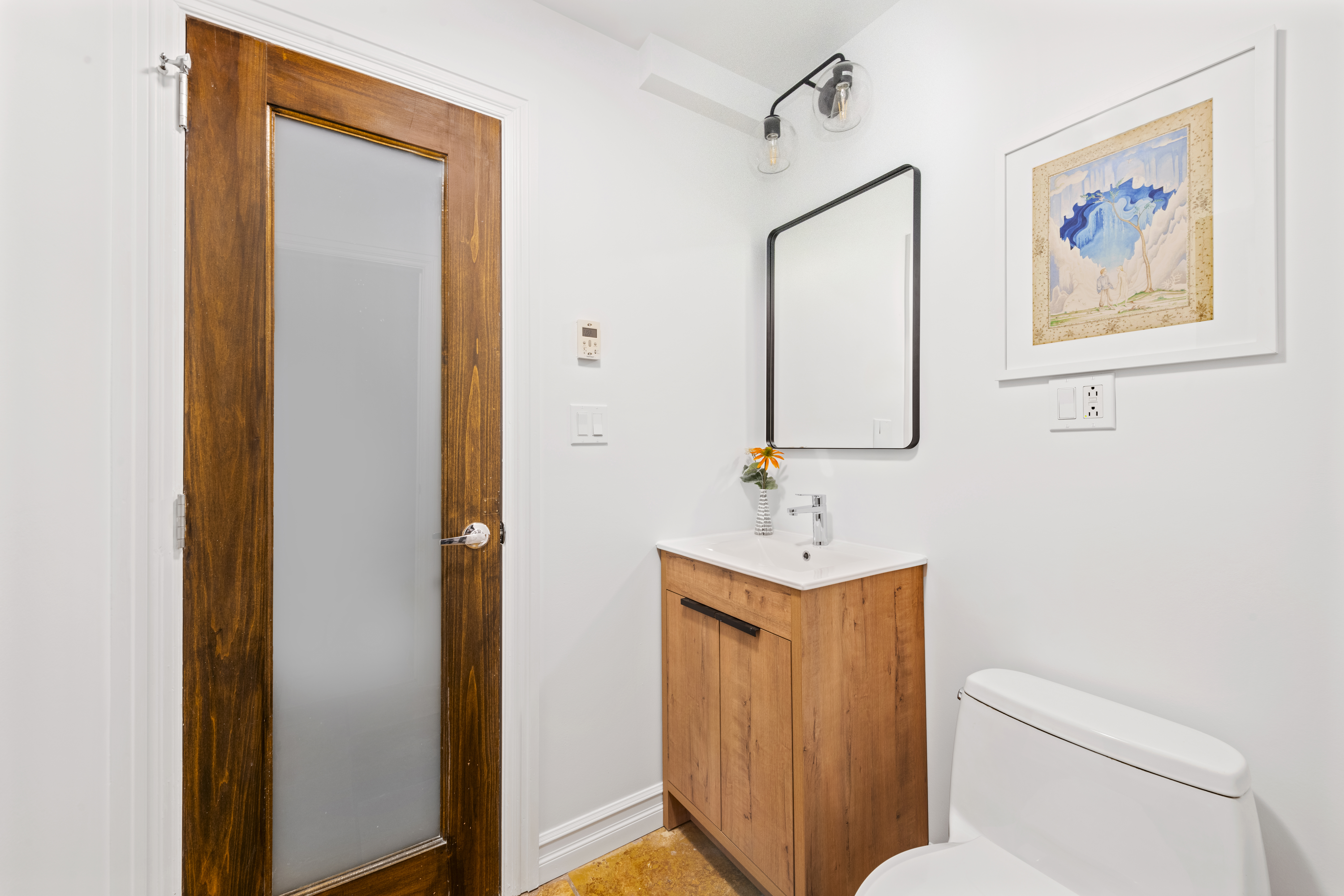 37 Powers Street, Unit 1A Brooklyn, NY 11211 - Photo 8 of 9 a bathroom with a toilet a sink and a mirror